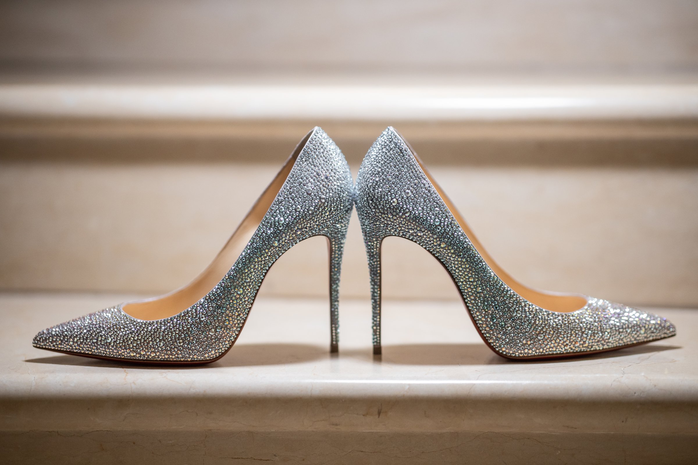 Elegant wedding shoes on marble stairs