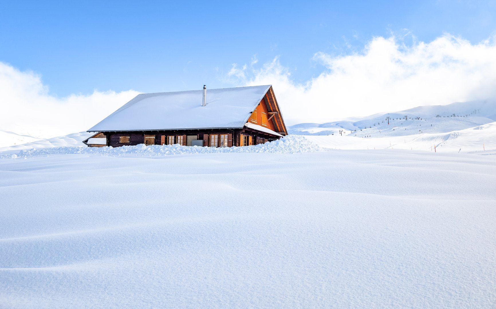 Ski slopes and mountains, luxury mountain resort village in winter