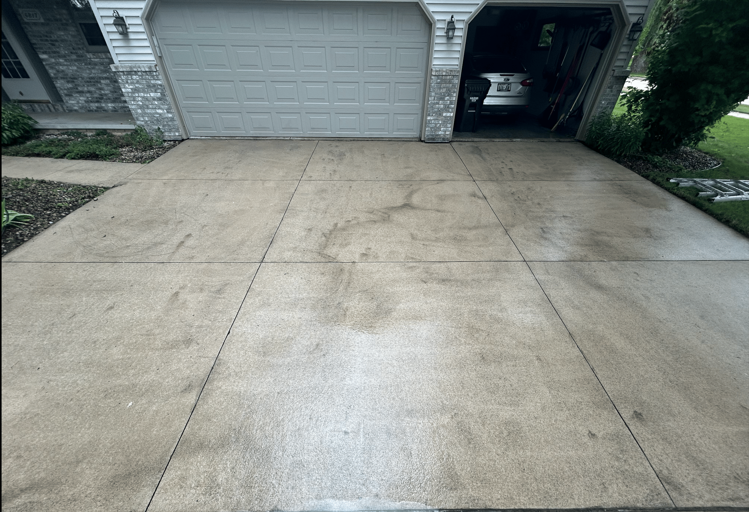 Driveway after pressure washing showing clean surface