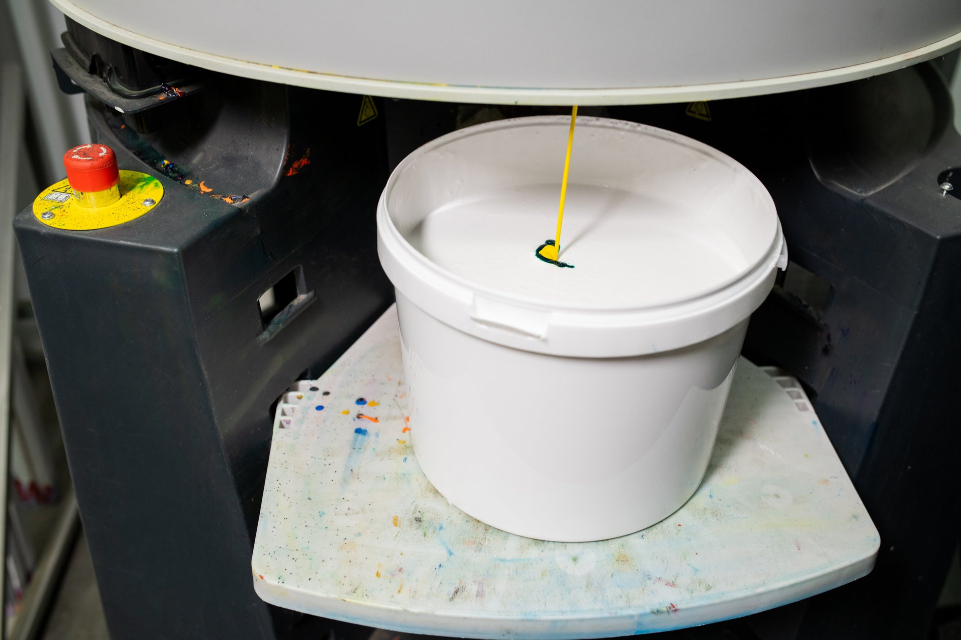 Plastic bucket with white paint for household needs