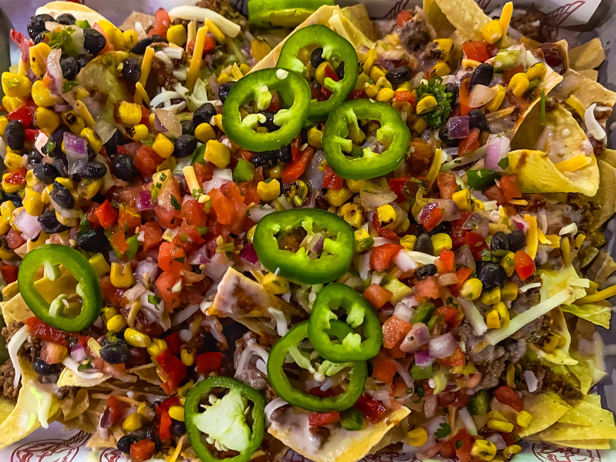 Platter of fully loaded nachos