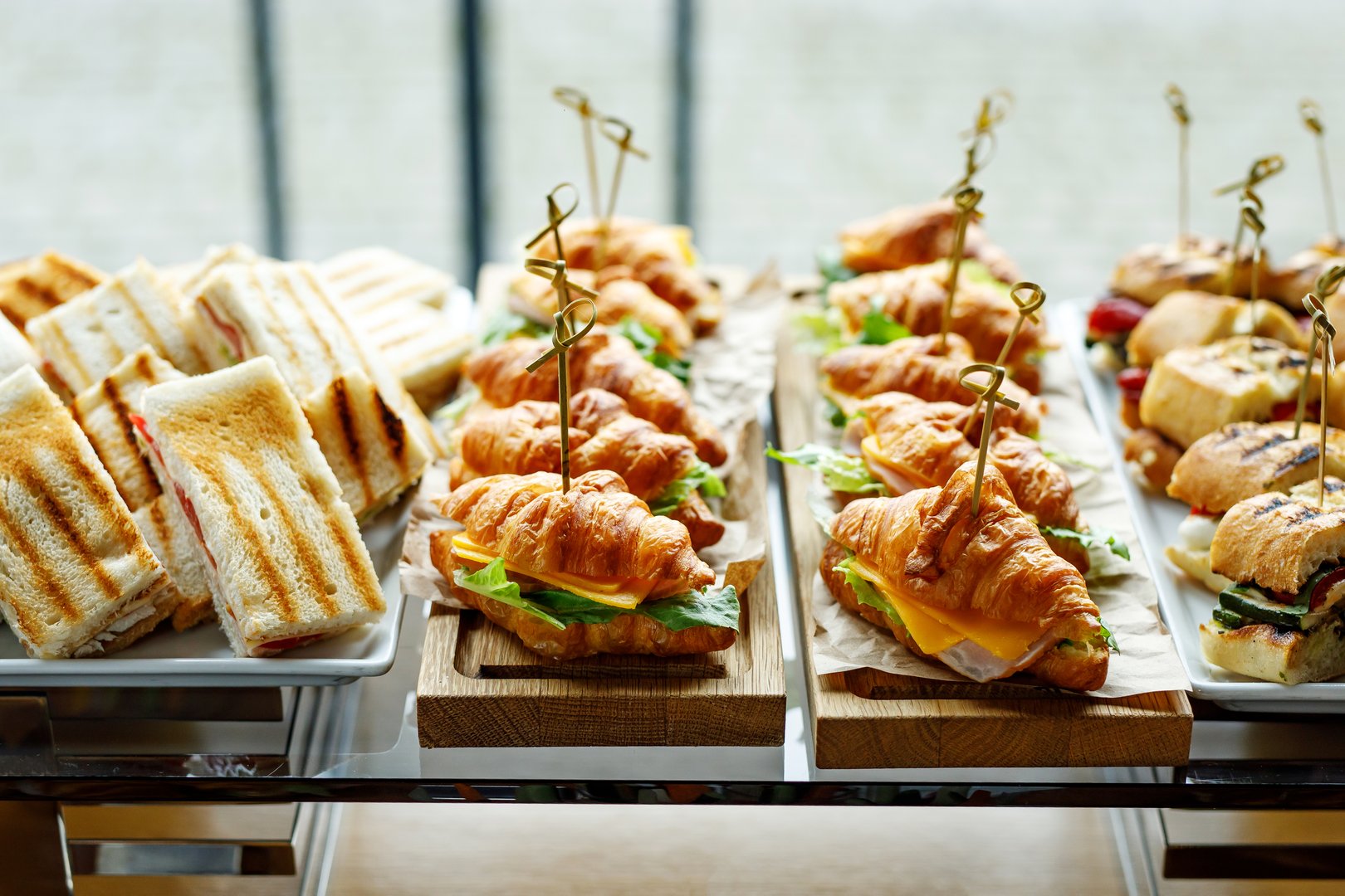 Stacks of croissant sandwich at event