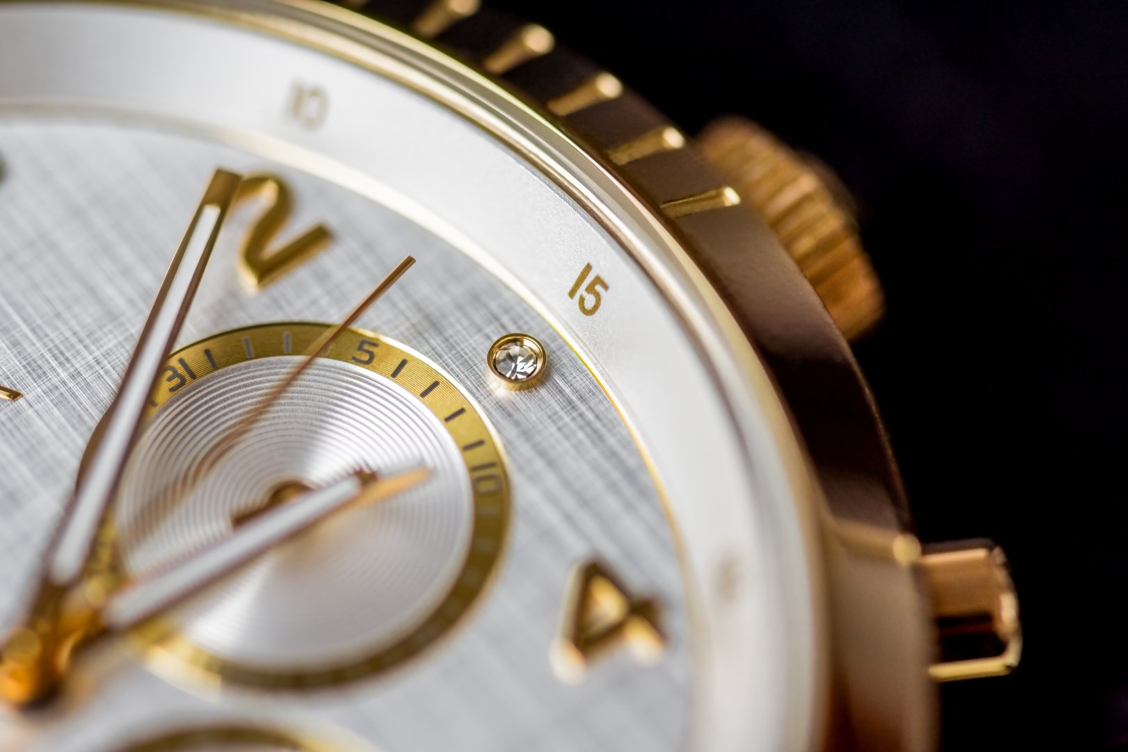 Classic gold chronograph wrist watch closeup. luxury watch detail.