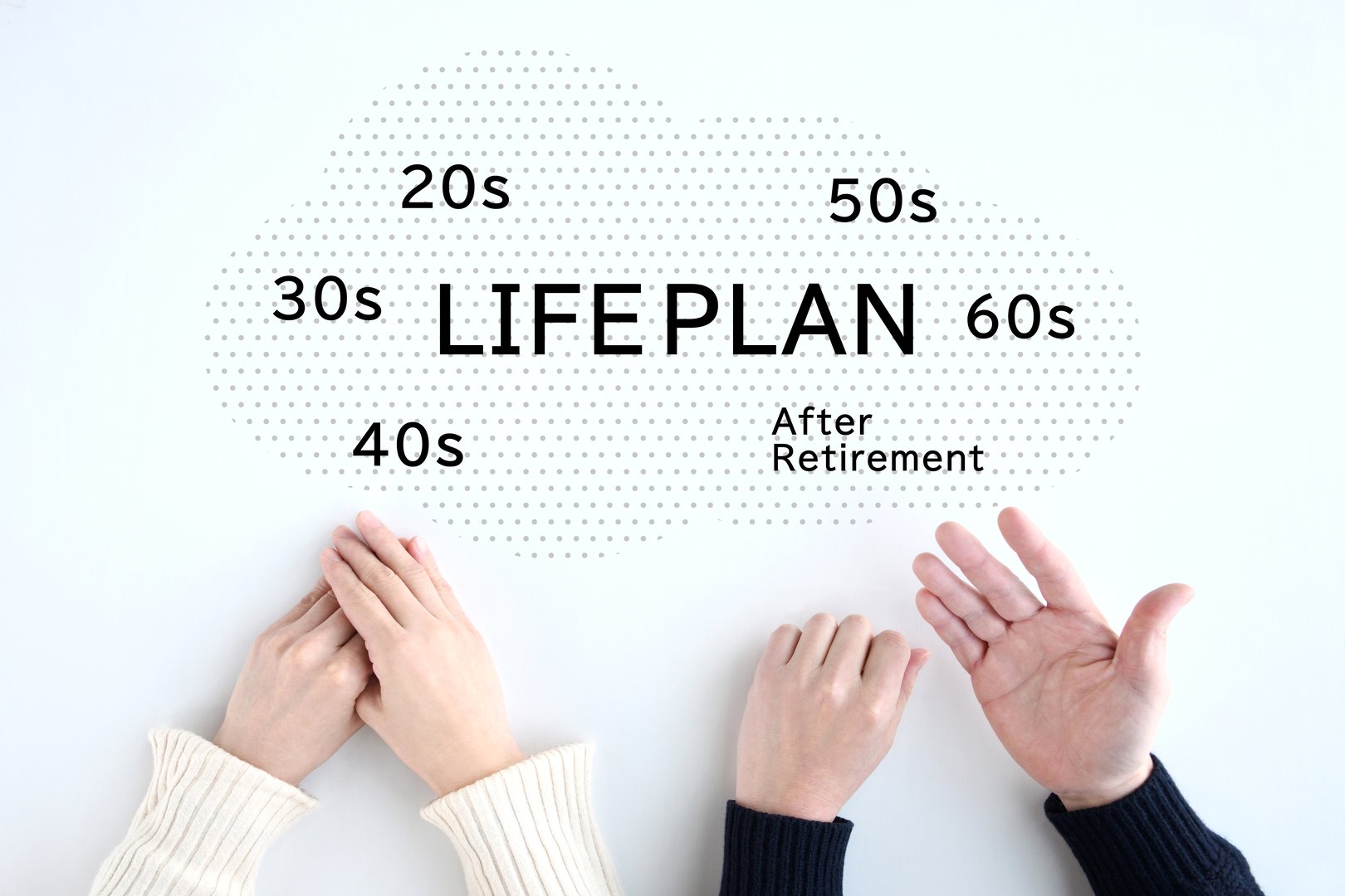 Couple's hands discussing retirement planning