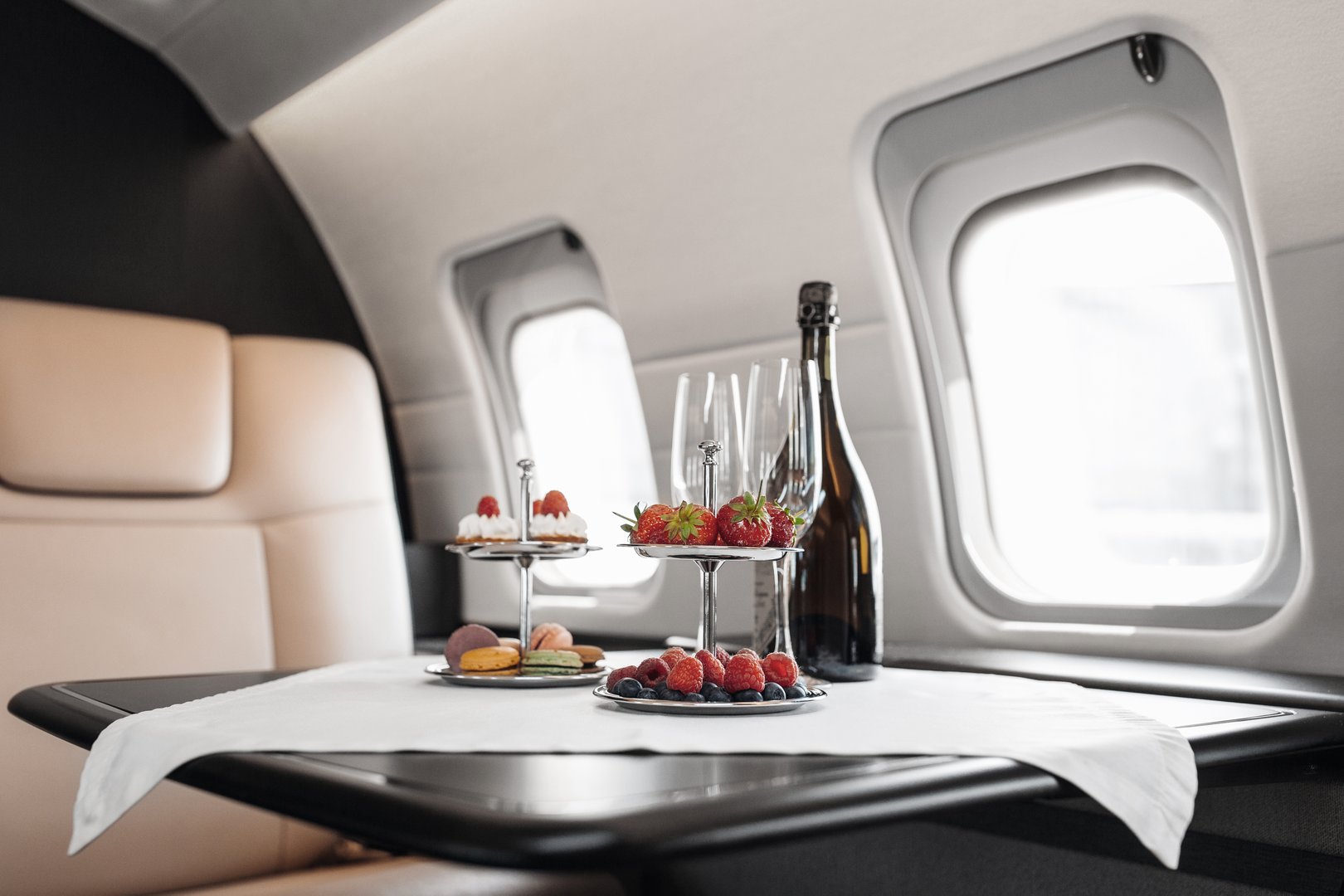 Business jet plane interior with leather comfortable seats. Private airplane transfer