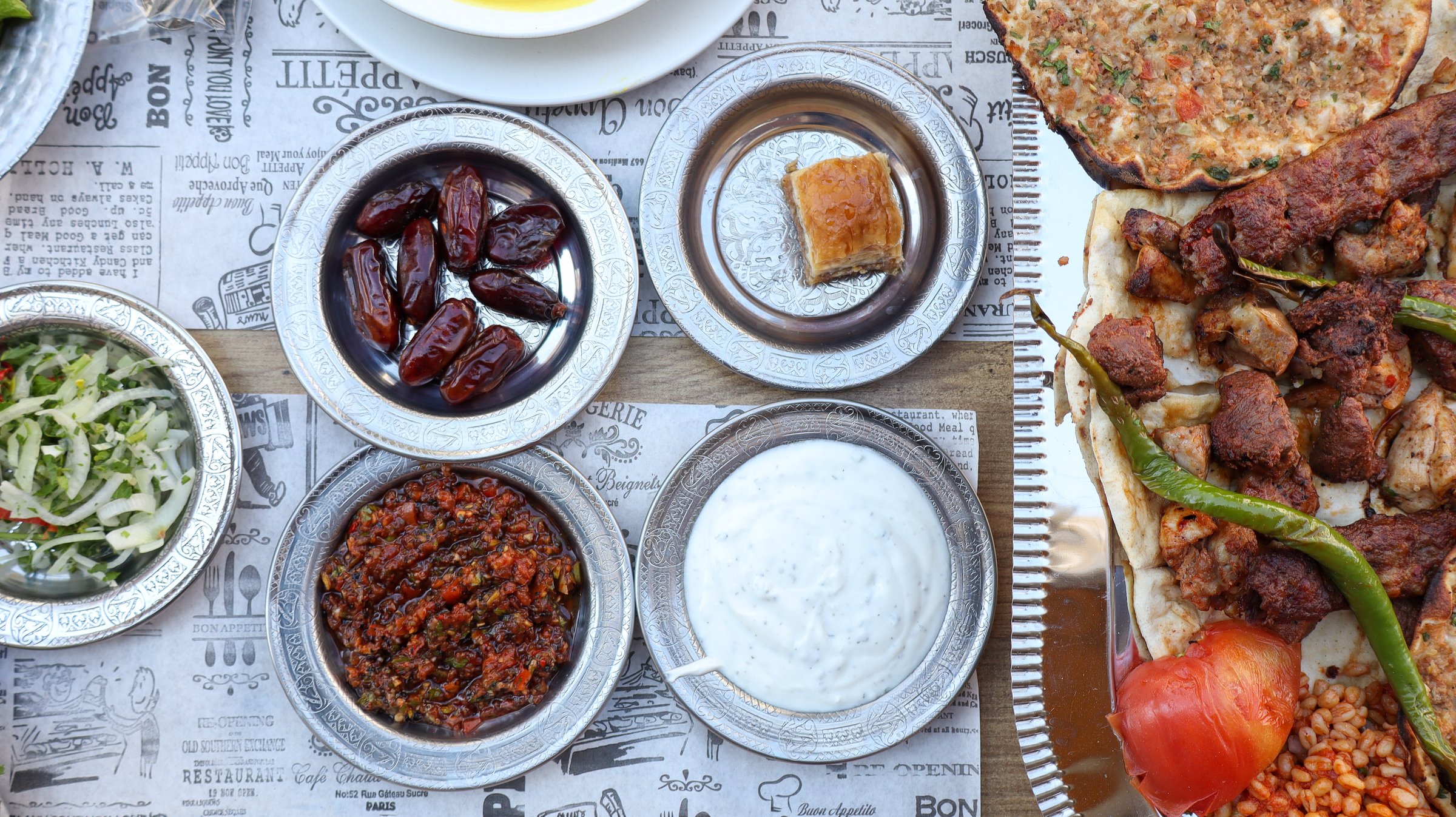 Traditional Turkish Cuisine Feast on Table Top View, Delicious Kebab Lahmacun Baklava Salad