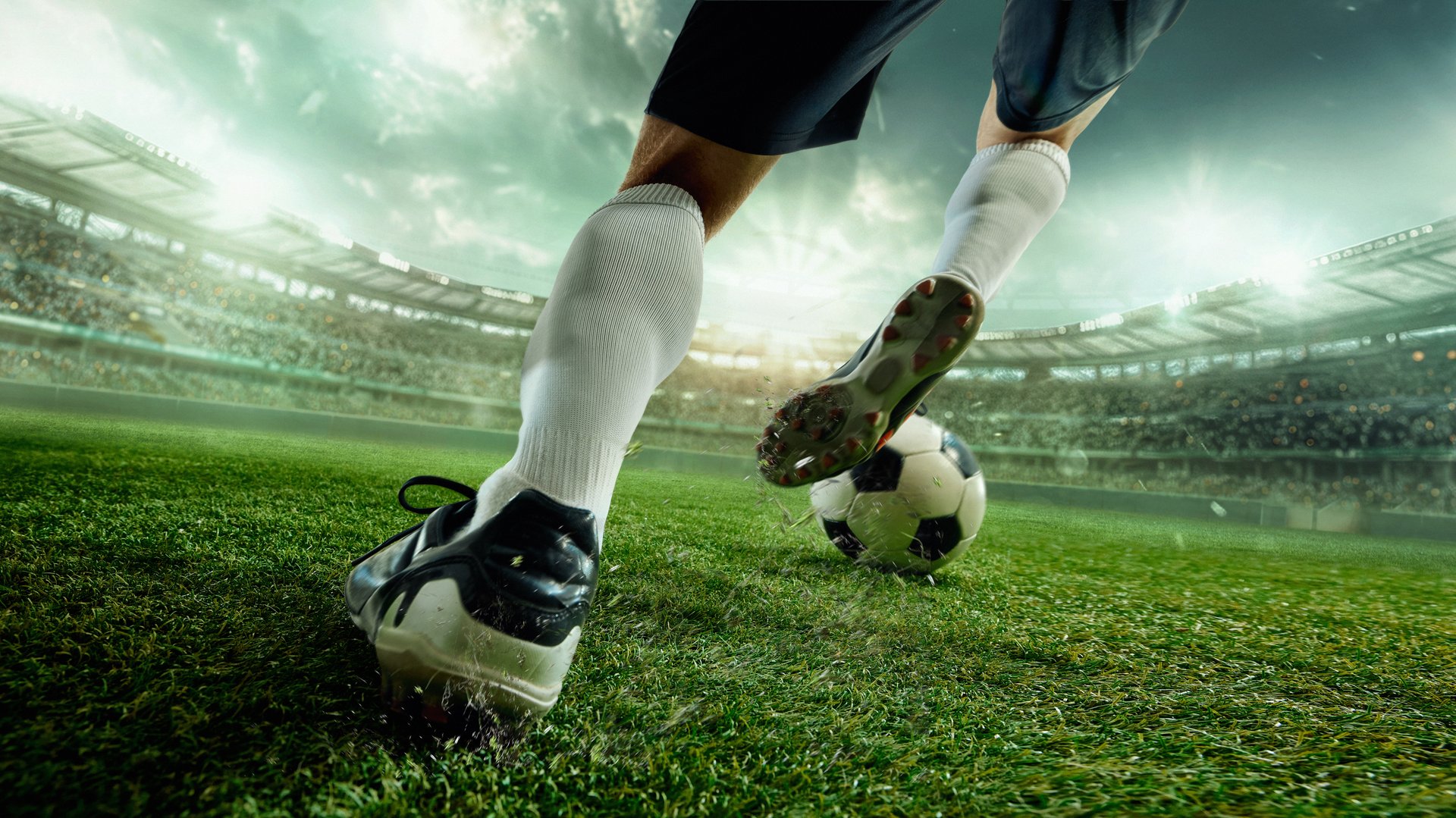 Faceless soccer player in white socks striking ball with power on green 3D stadium field. Concept of determination, competitive spirit, branding, sports marketing and emotional campaigns.