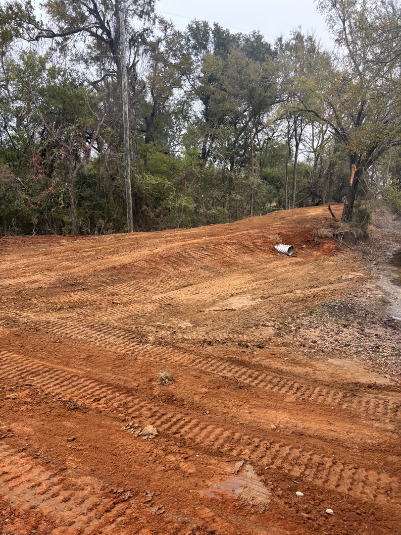 Access road with culvert installation