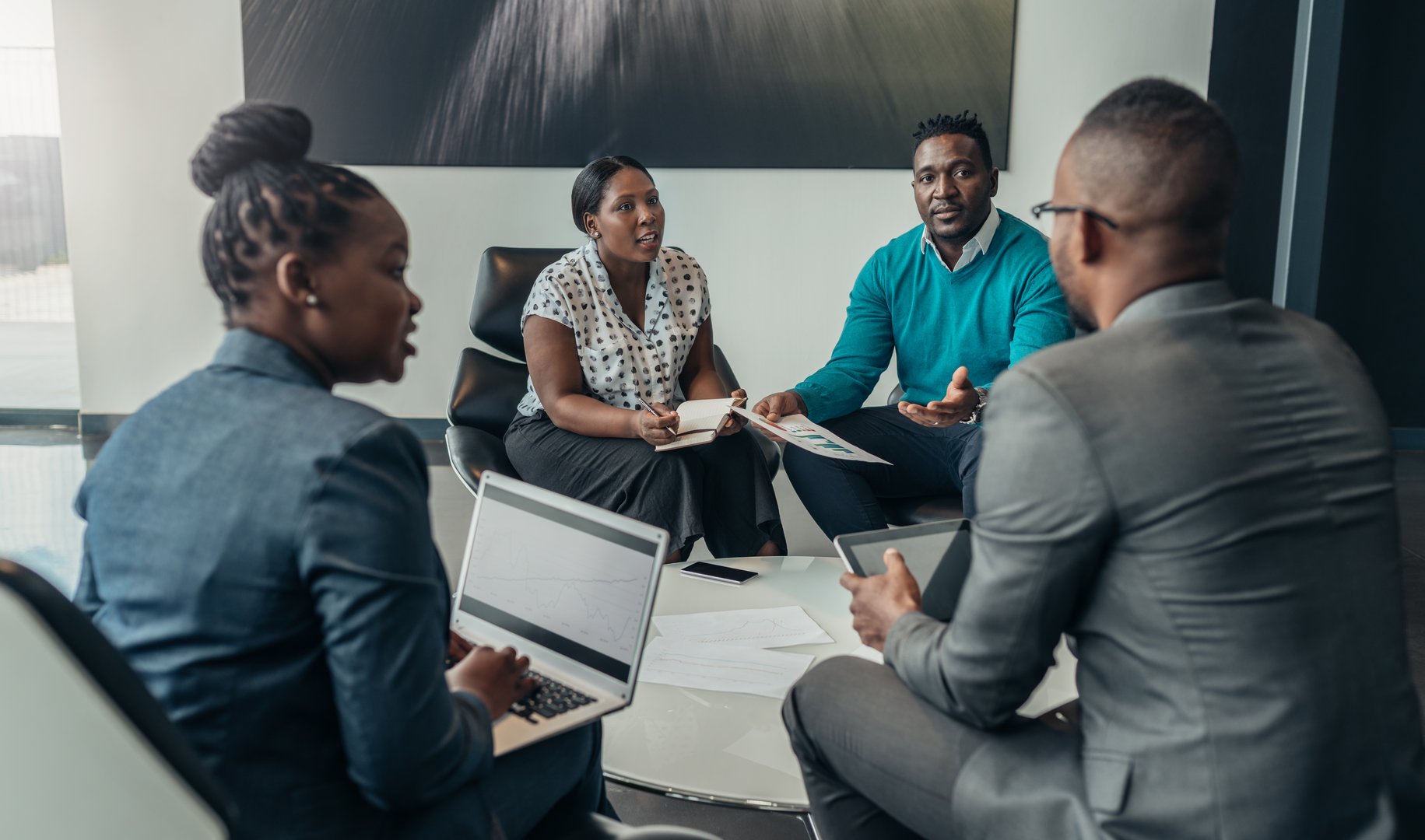 Team of african bussines people debating during a work meeting. Colleagues in serious discussions