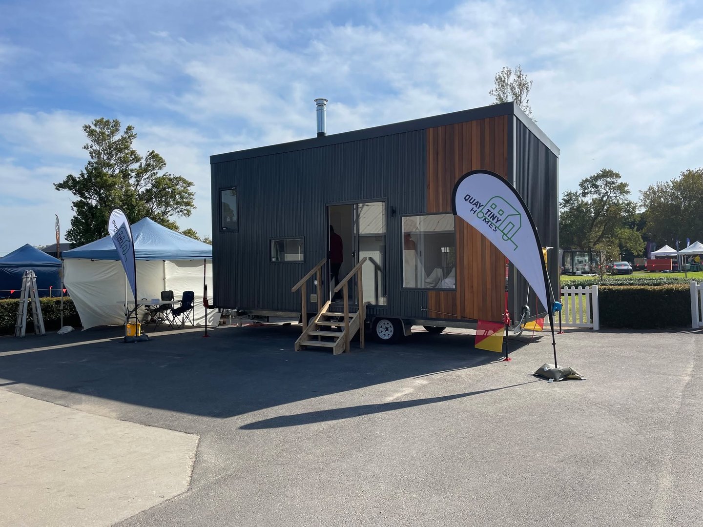 Quay Tiny Homes custom tiny house exterior with modern design featuring timber cladding and large windows