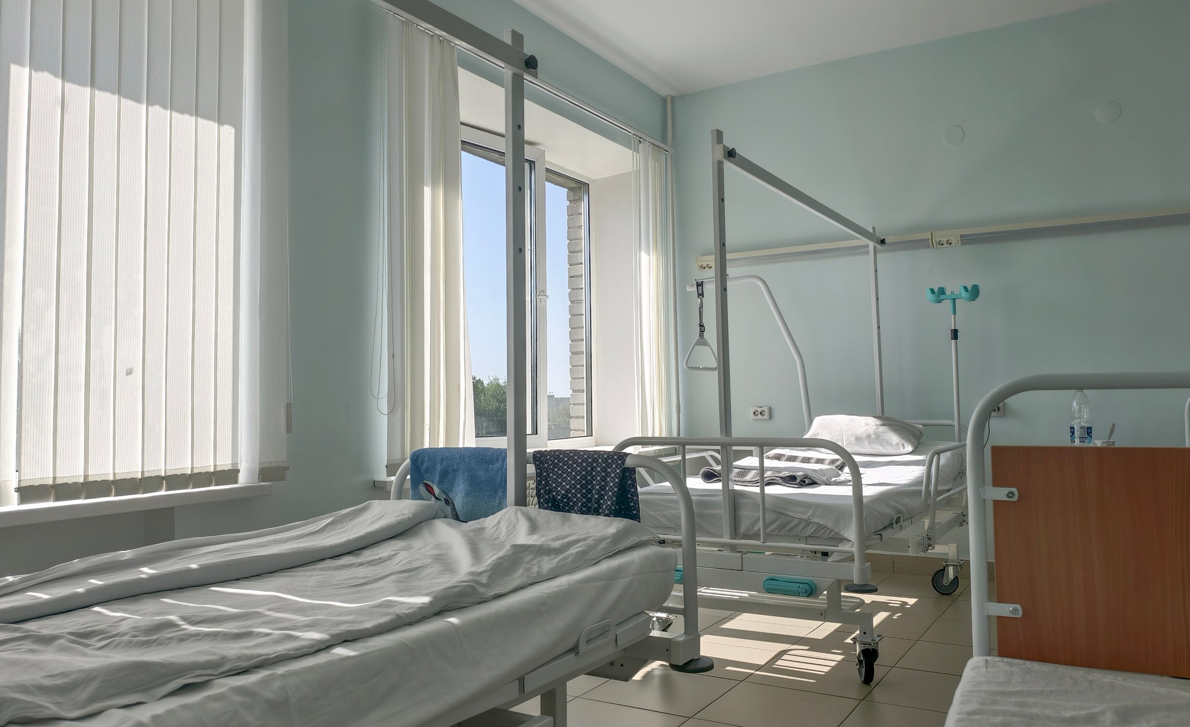 a room for rehabilitation treatment in a clinical hospital with beds for several people.