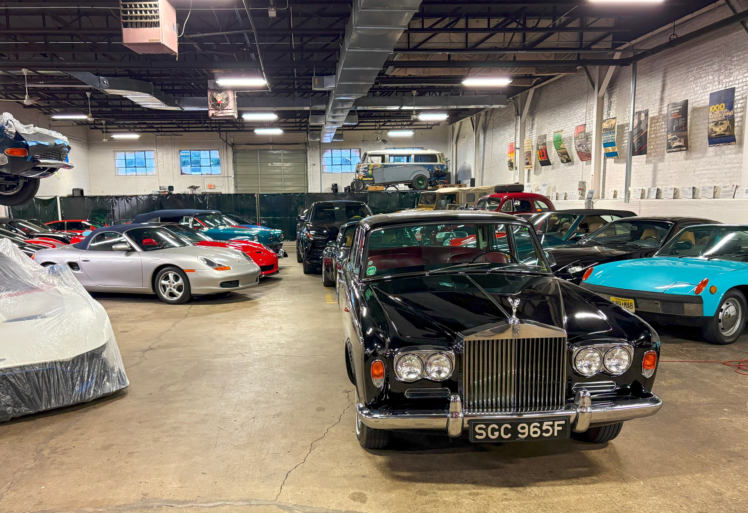 Whippany, New Jersey, USA - 28 June 2025: Numerous vintage and classic cars are neatly arranged in an expansive garage space.