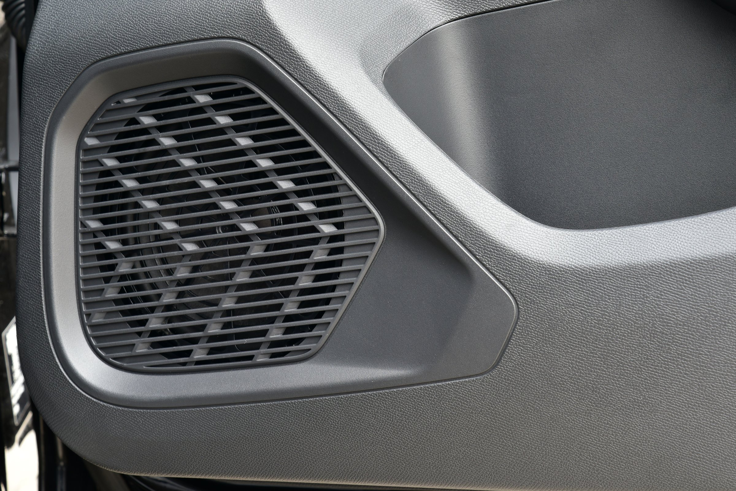 High frequency speaker panels. Car speakers on the door panel. Automotive and transportation equipment. Car audio speakers installed on high-tech interior. Car audio speaker inside the car.