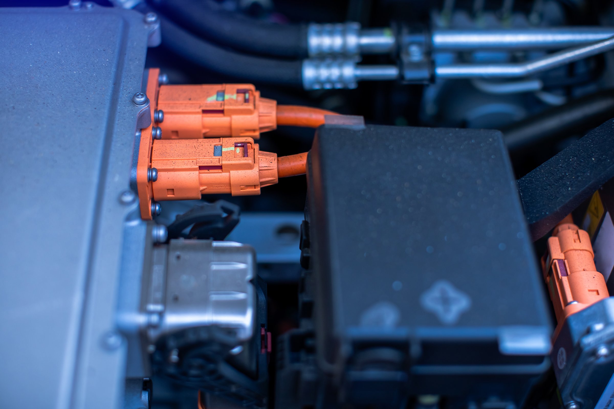 EV engine car engine block under hood electric vehicle high power and environmentally friendly zero emission. Chassis of the electric car with powertrain and power connection,electric system.