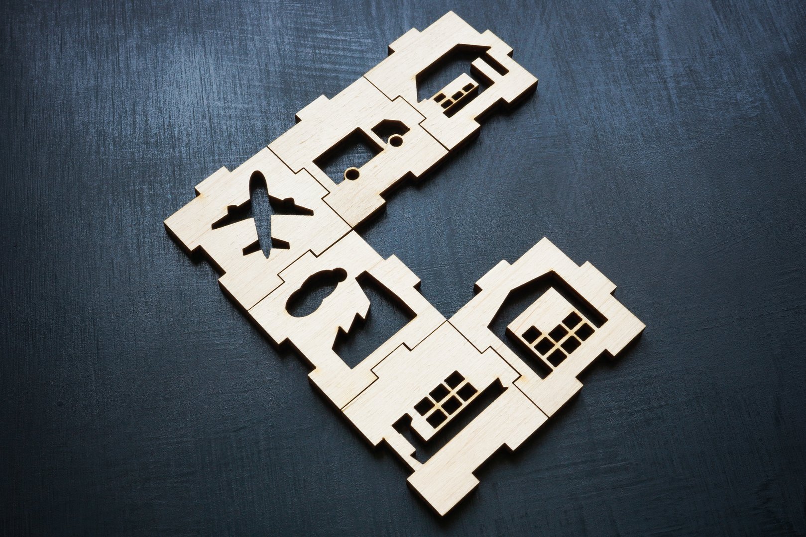 Wooden puzzle about supply chain management. Interconnected processes and efficient logistics.