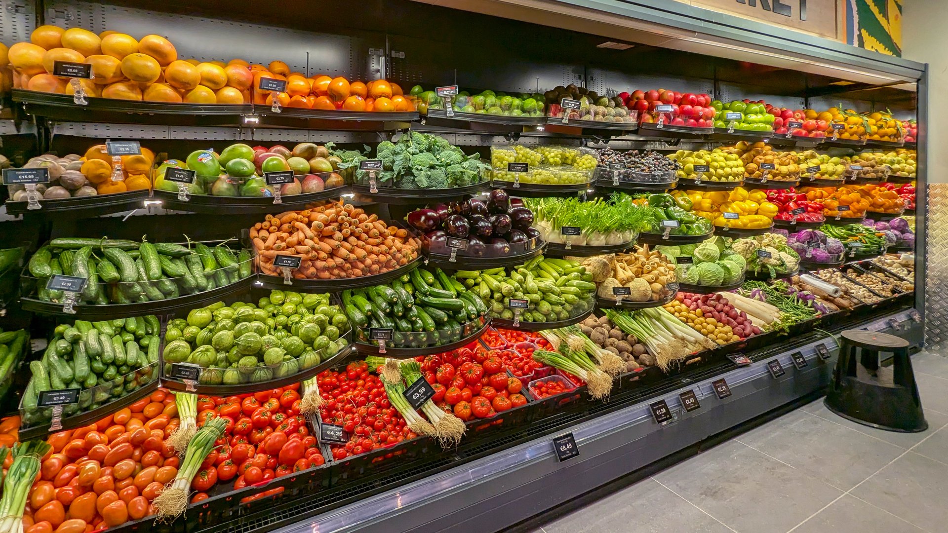 Assortment of vibrant fresh fruits and vegetables in grocery store fresh Fruits and Vegetables section