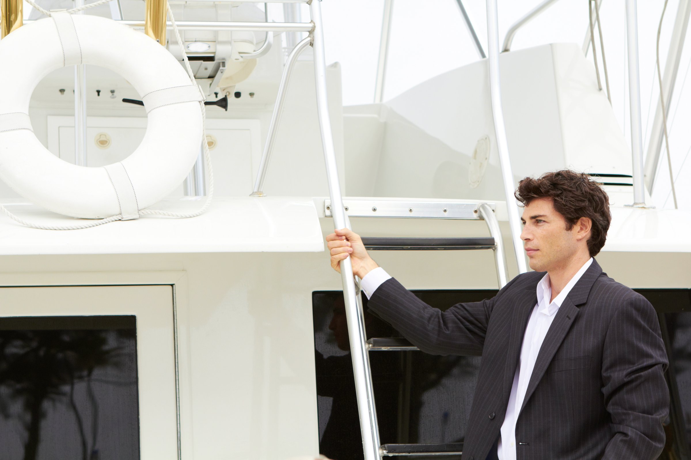 Happy Rich Successful Young Business Man On His Yacht