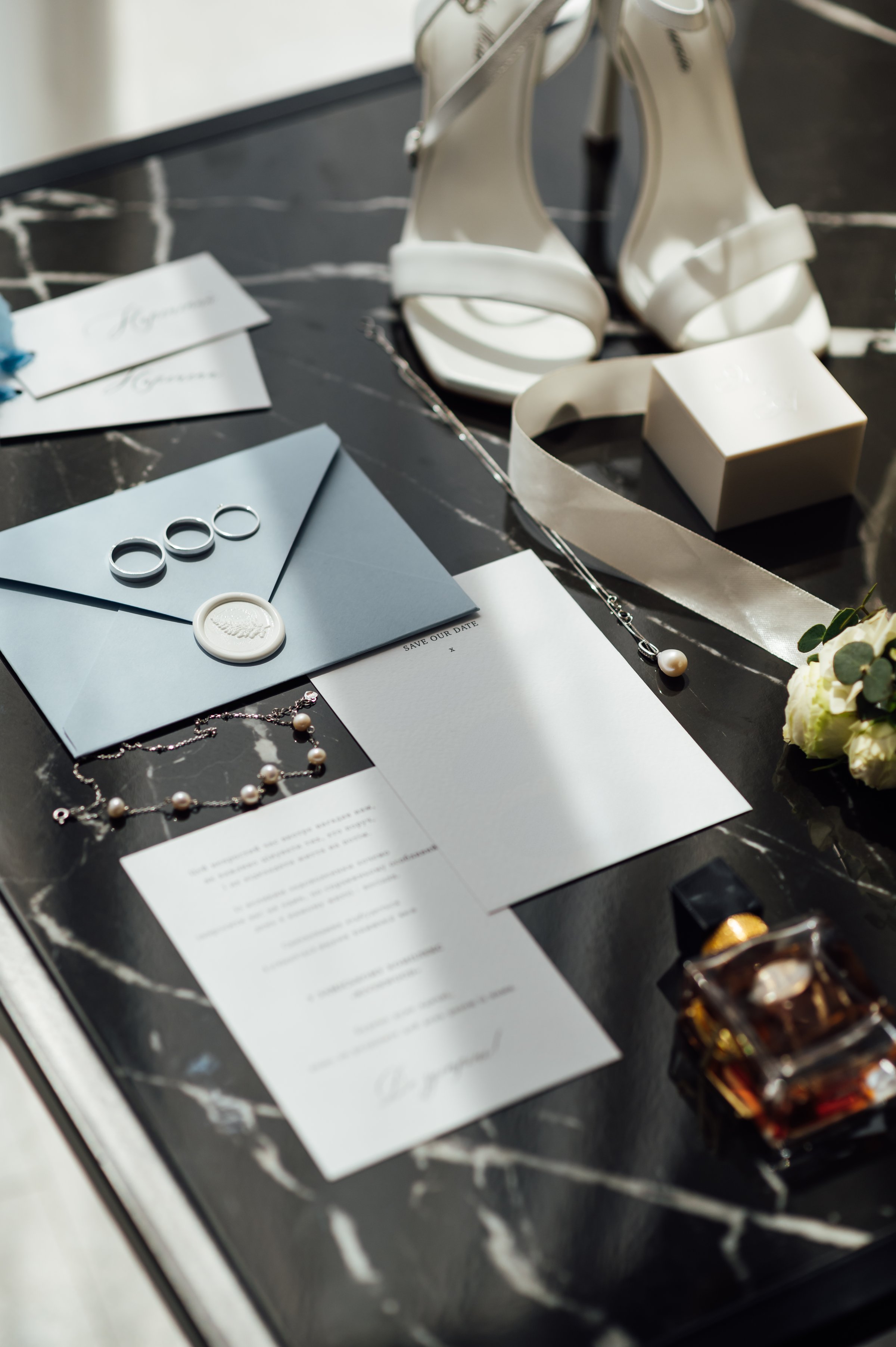 Wedding invitations. Wedding details of the bride. Bridal bouquet and other accessories. Shoes of the bride.