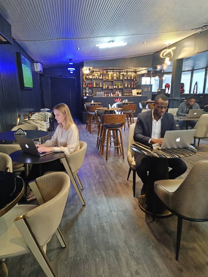 Modern cafe interior with comfortable seating and warm lighting