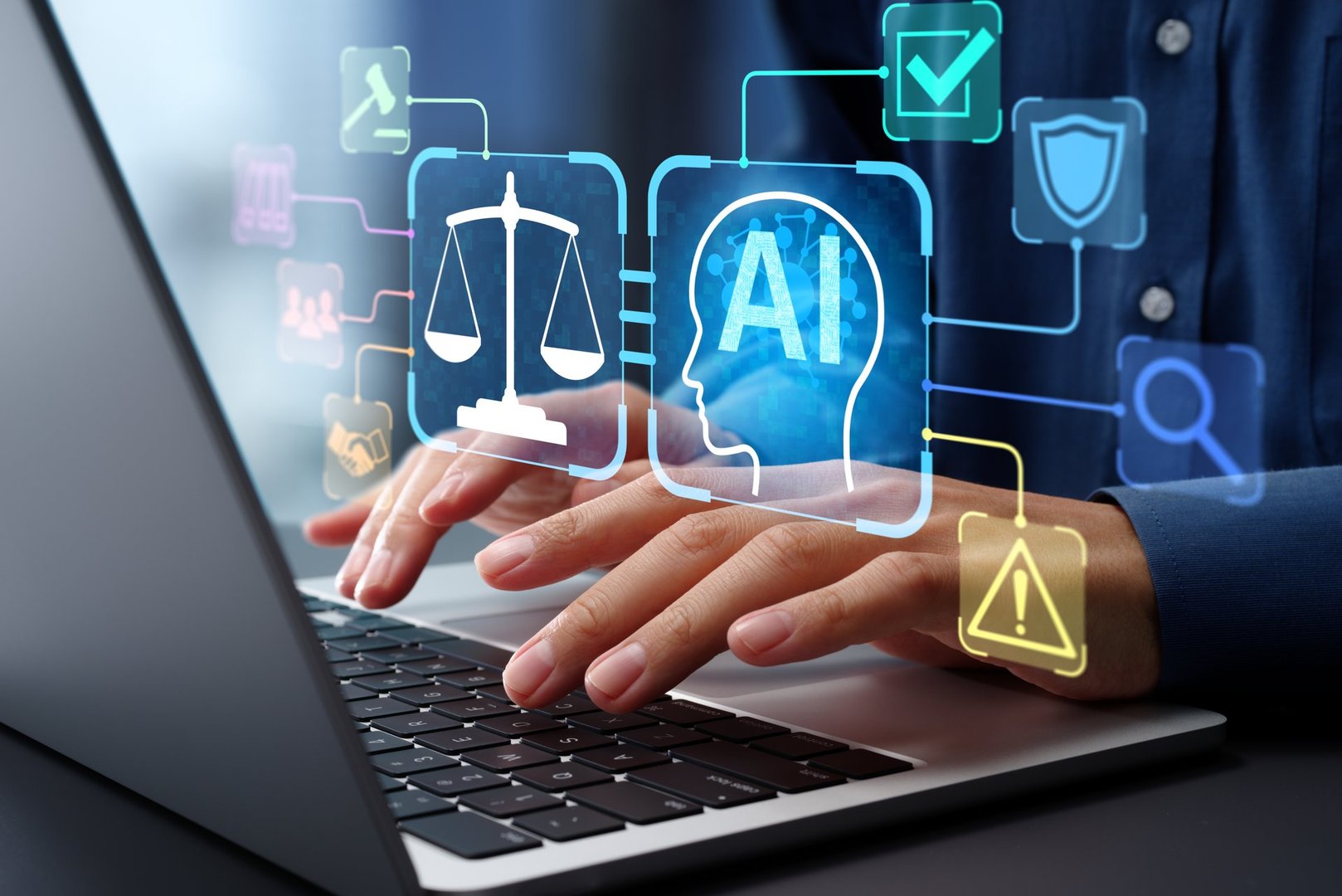 Businessman typing on laptop computer keyboard at desk in office.
