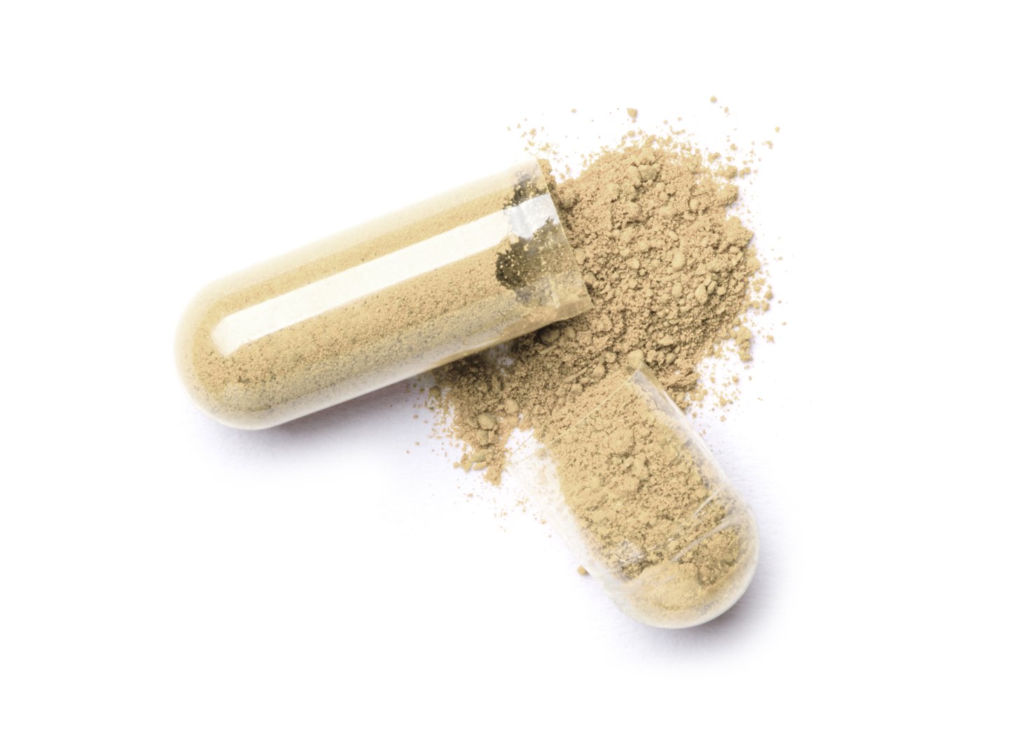 Maca powder herbal medicine capsule isolated on white background. Top view.