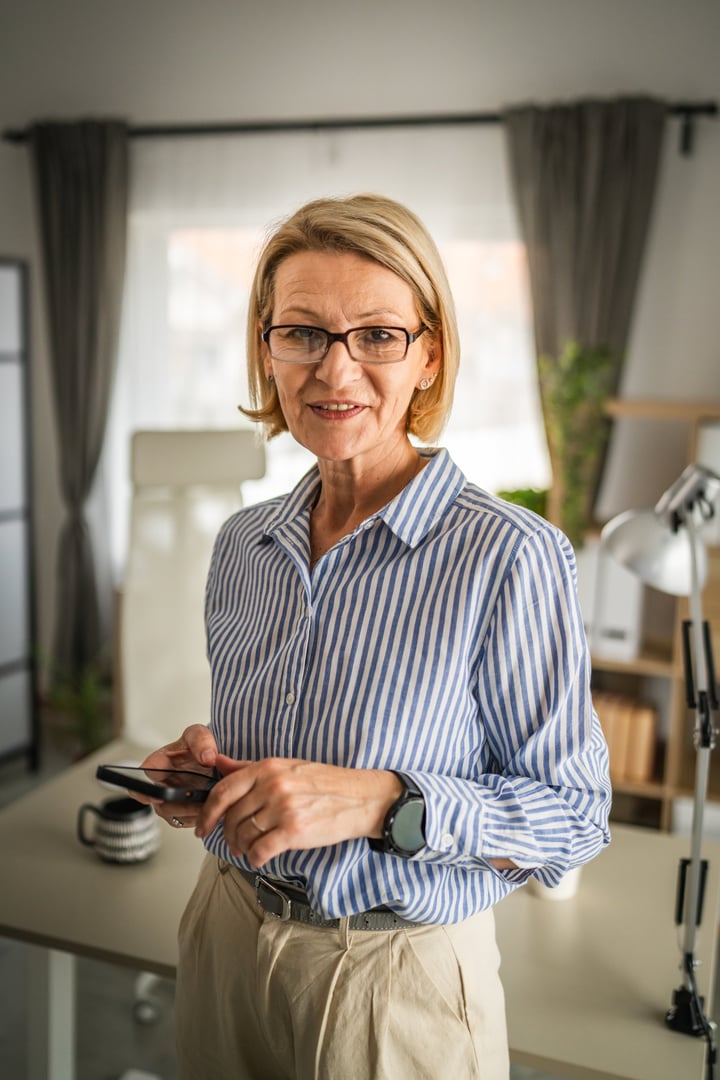 One woman mature caucasian female use mobile smart phone sms texting