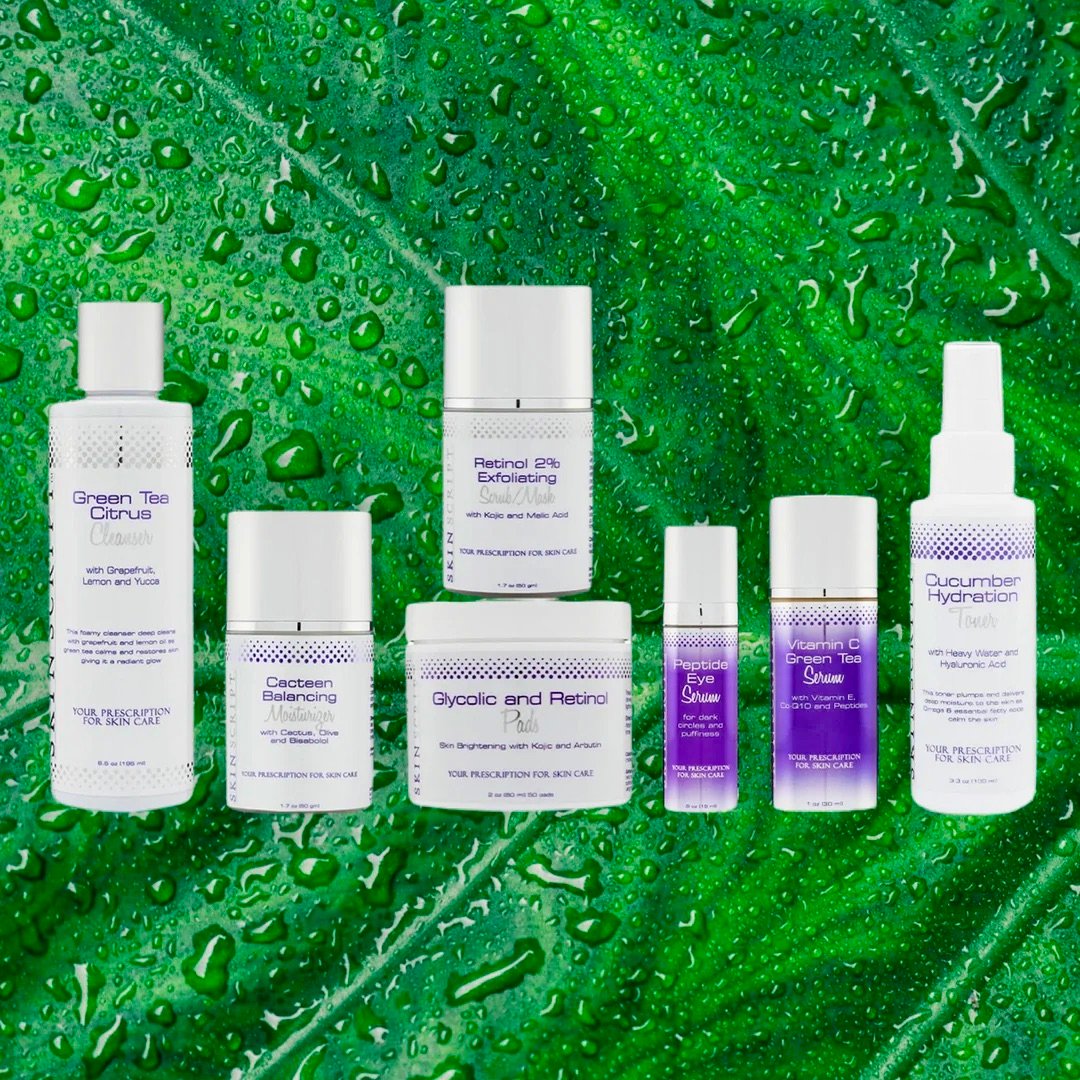 Skincare products on a leafy wet background, including exfoliants, serums, and hydration sprays in various bottles.