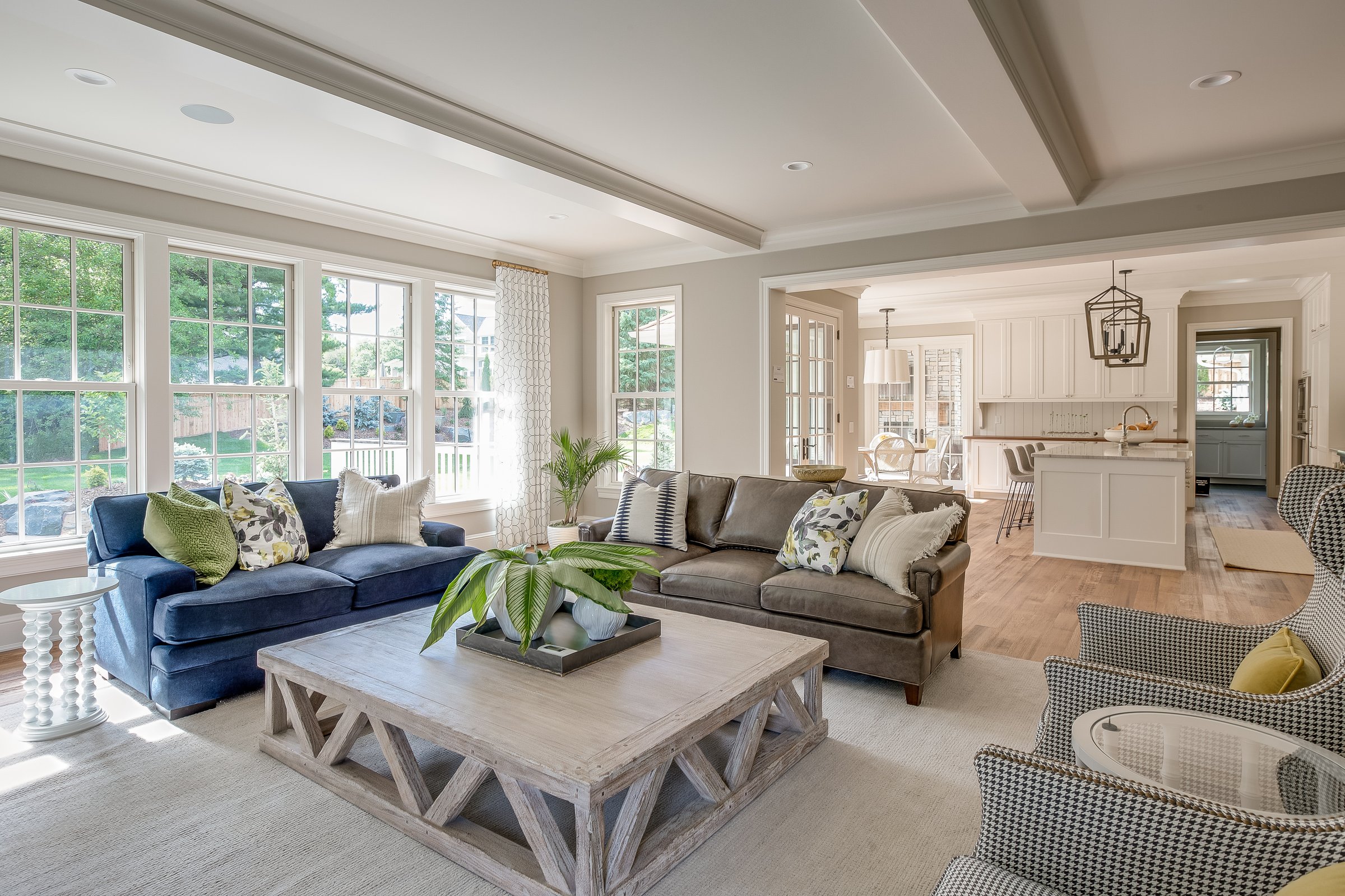 Kitchen in background with comfortable seating in large great room