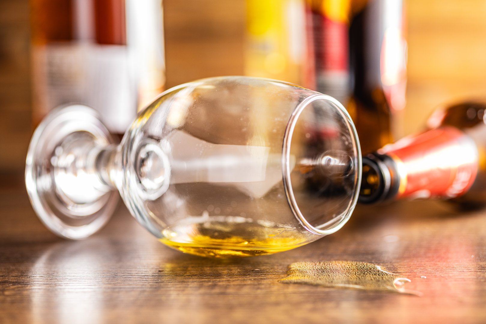 Empty spilled glass of beer on a table.