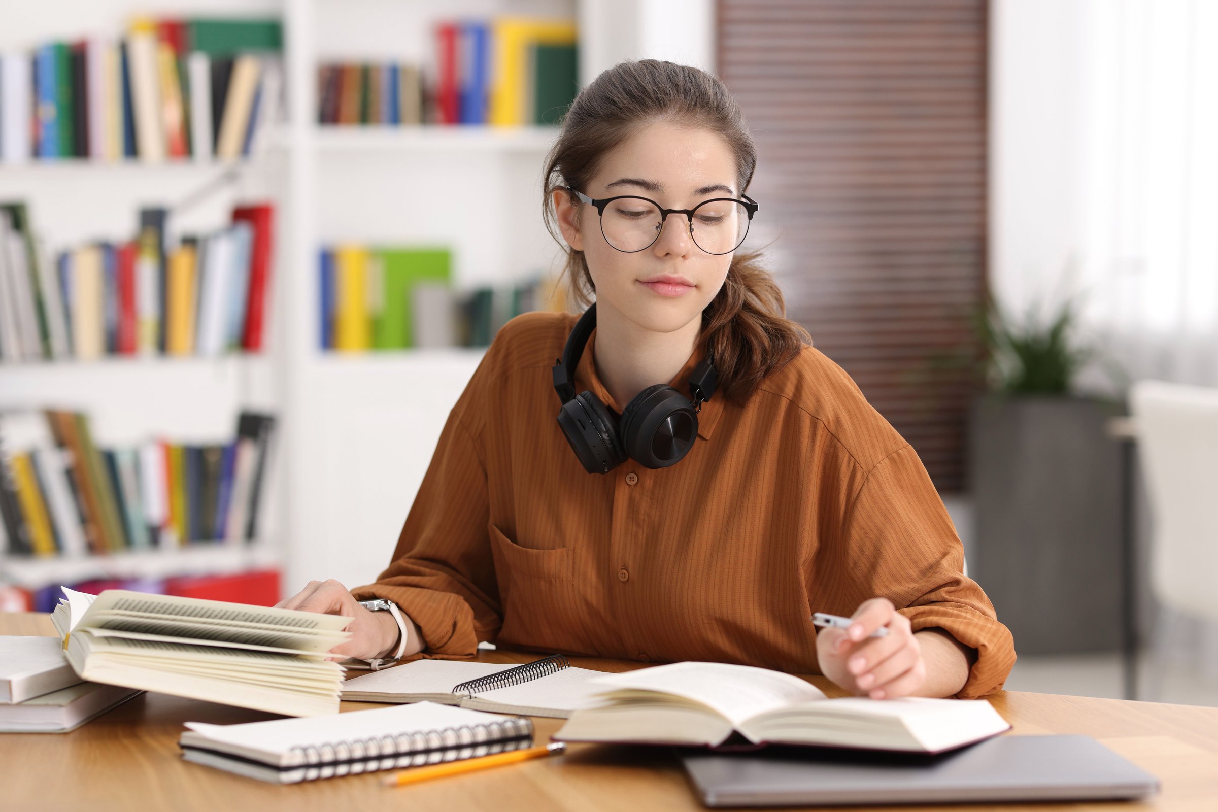 Student preparing for exam at table indoors