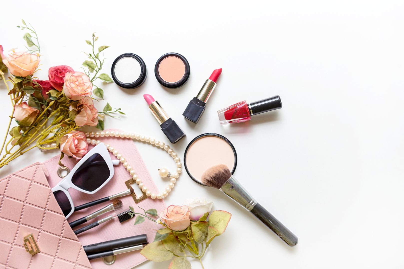 Valentine Gift. Makeup cosmetics tools background and beauty cosmetics, products and facial cosmetics package with flower rose and Pearl necklace. Lifestyle and Valentine