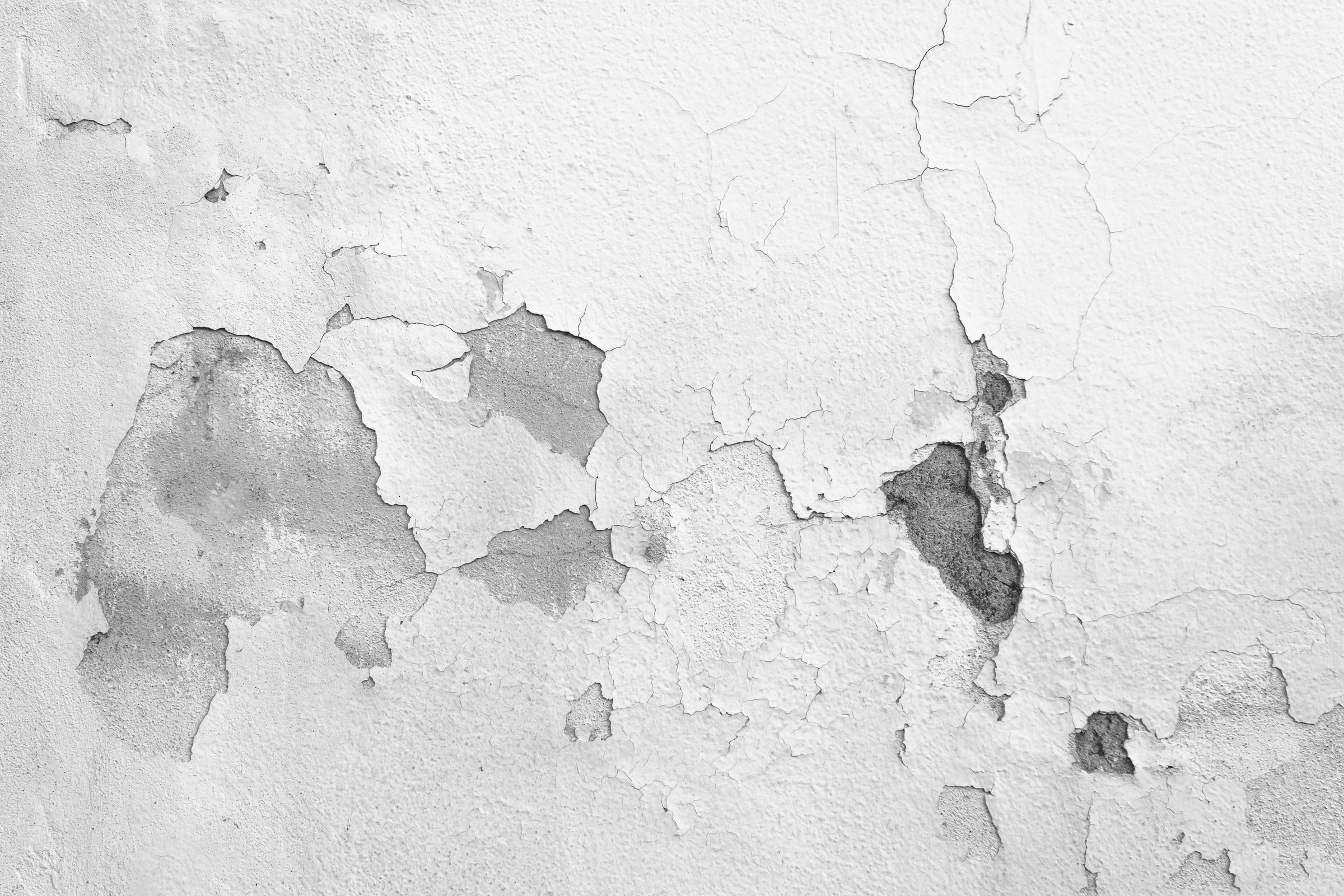 Damaged walls holes in drywall water stains