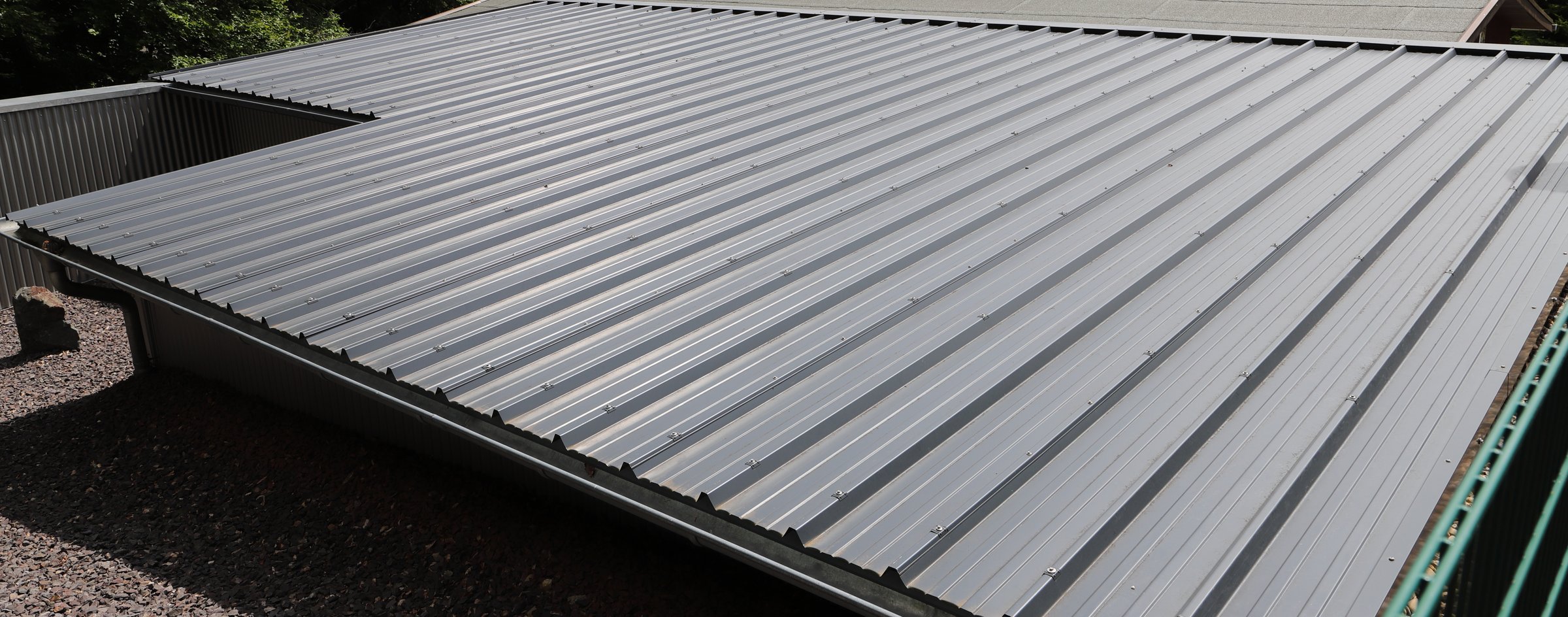 a roof with gray trapezoidal sheet metal