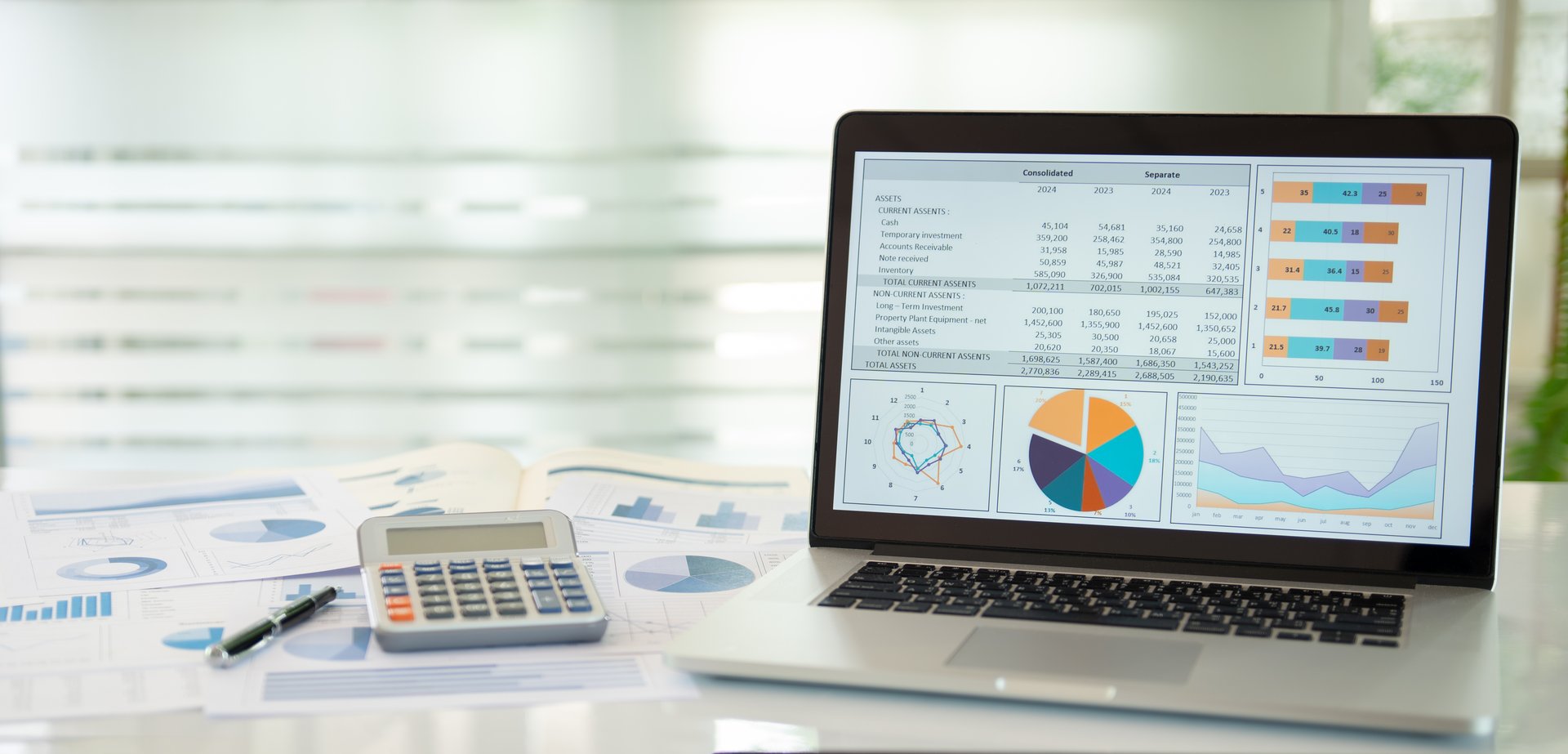 Financial graph showing a comparative analysis of business growth 
with annual financial statement report and calculator on desk with copy space.