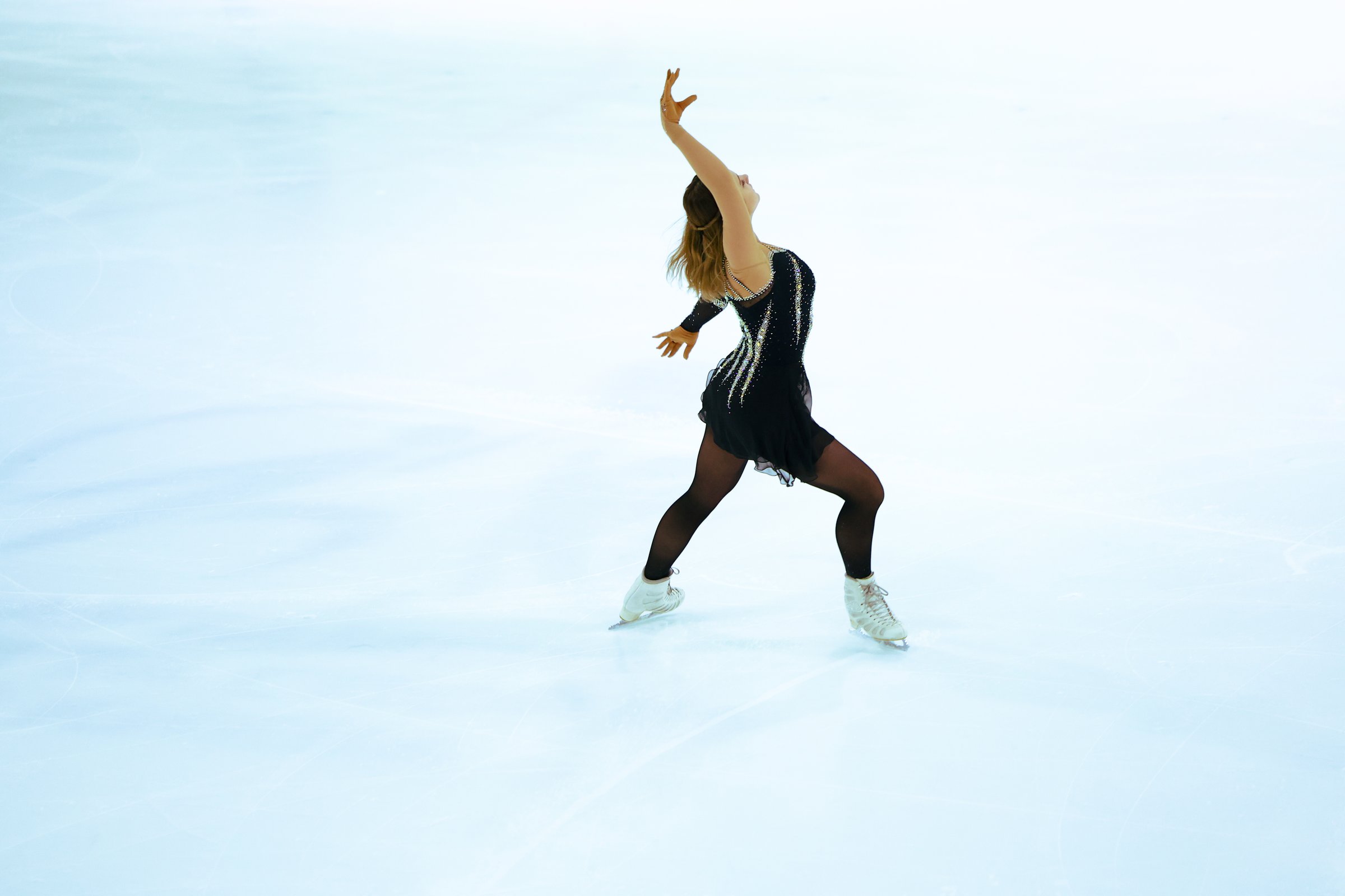 Figure skater girl in skating ice.