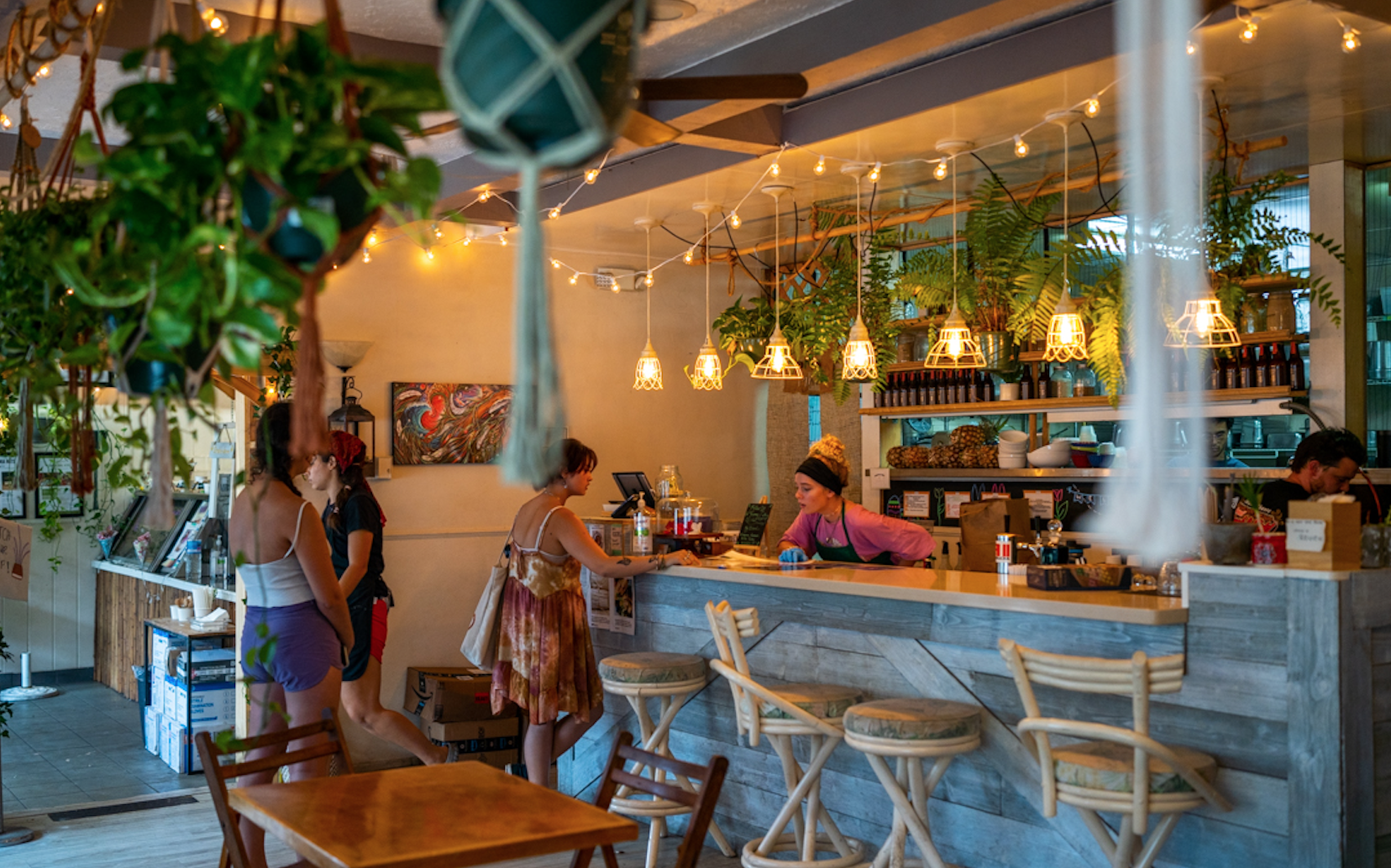 Cozy interior of Journey Cafe Big Island featuring plant-based bowls and warm natural lighting in Kailua-Kona