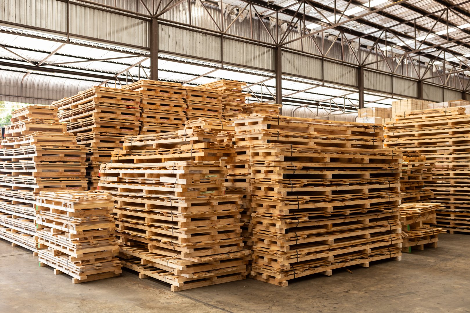 Stack of raw wood, Lumber warehouse storage wooden. Timber goods storehouse. wood import-export industry.