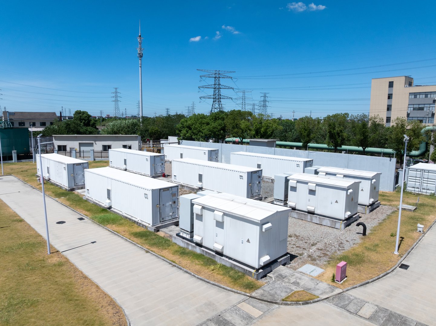 Aerial view of battery energy storage systems under a clear blue sky