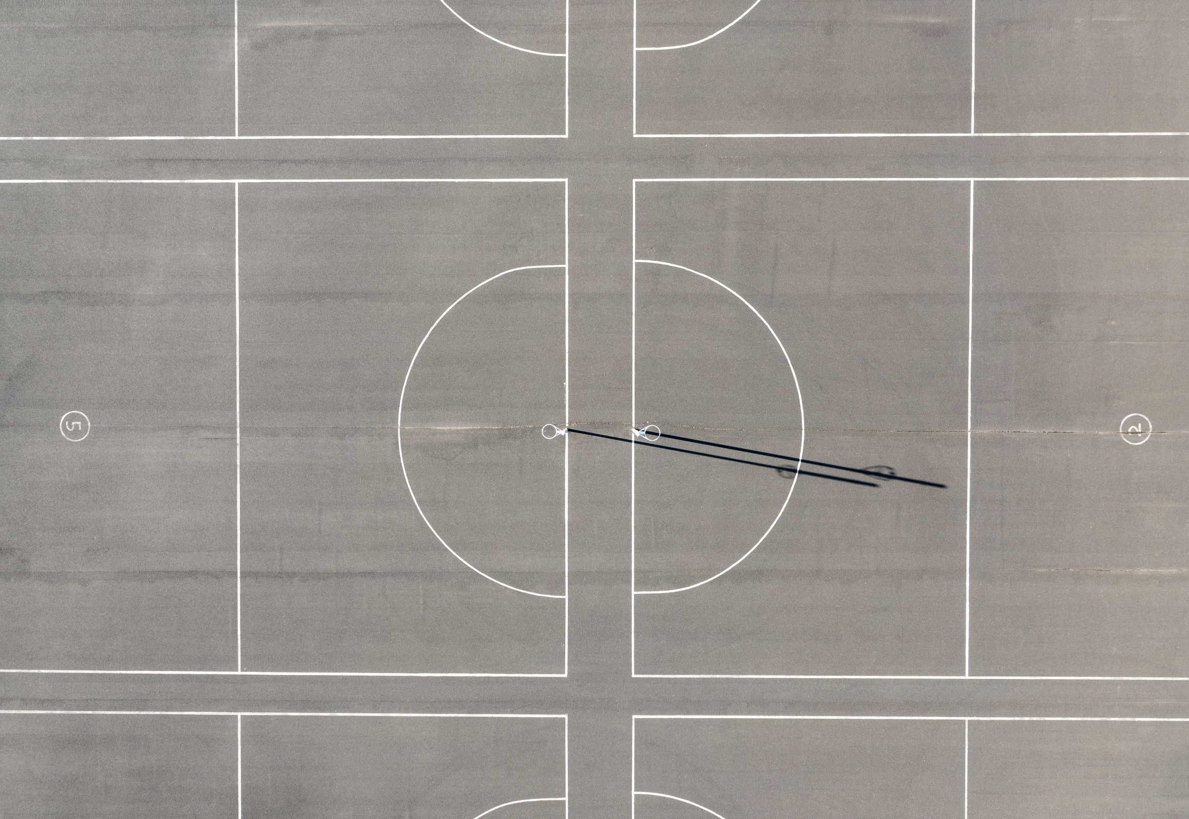 A top down view of empty Netball courts in Australia.