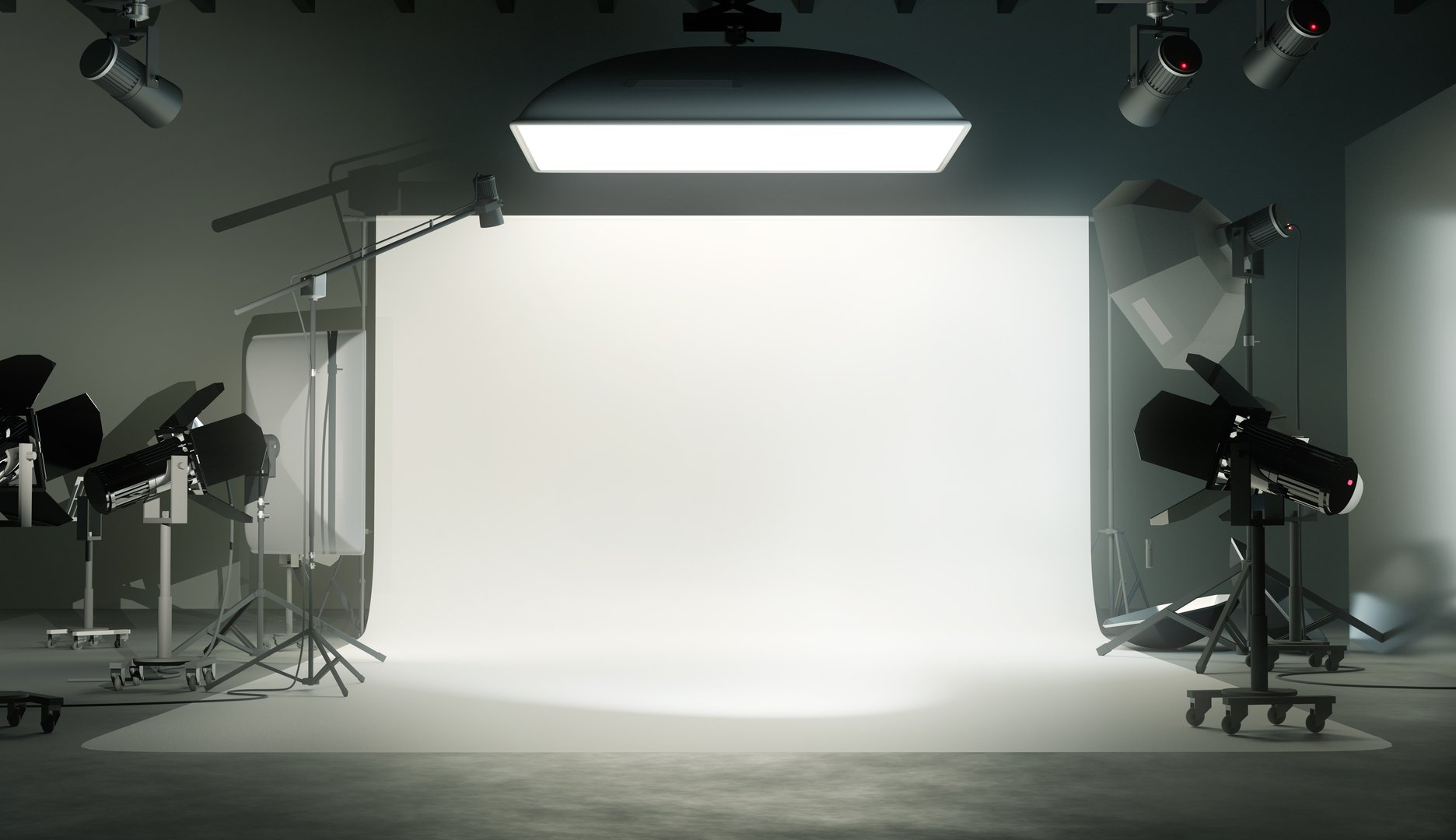 A photo studio room with a white plain backdrop and various lighting equipment
