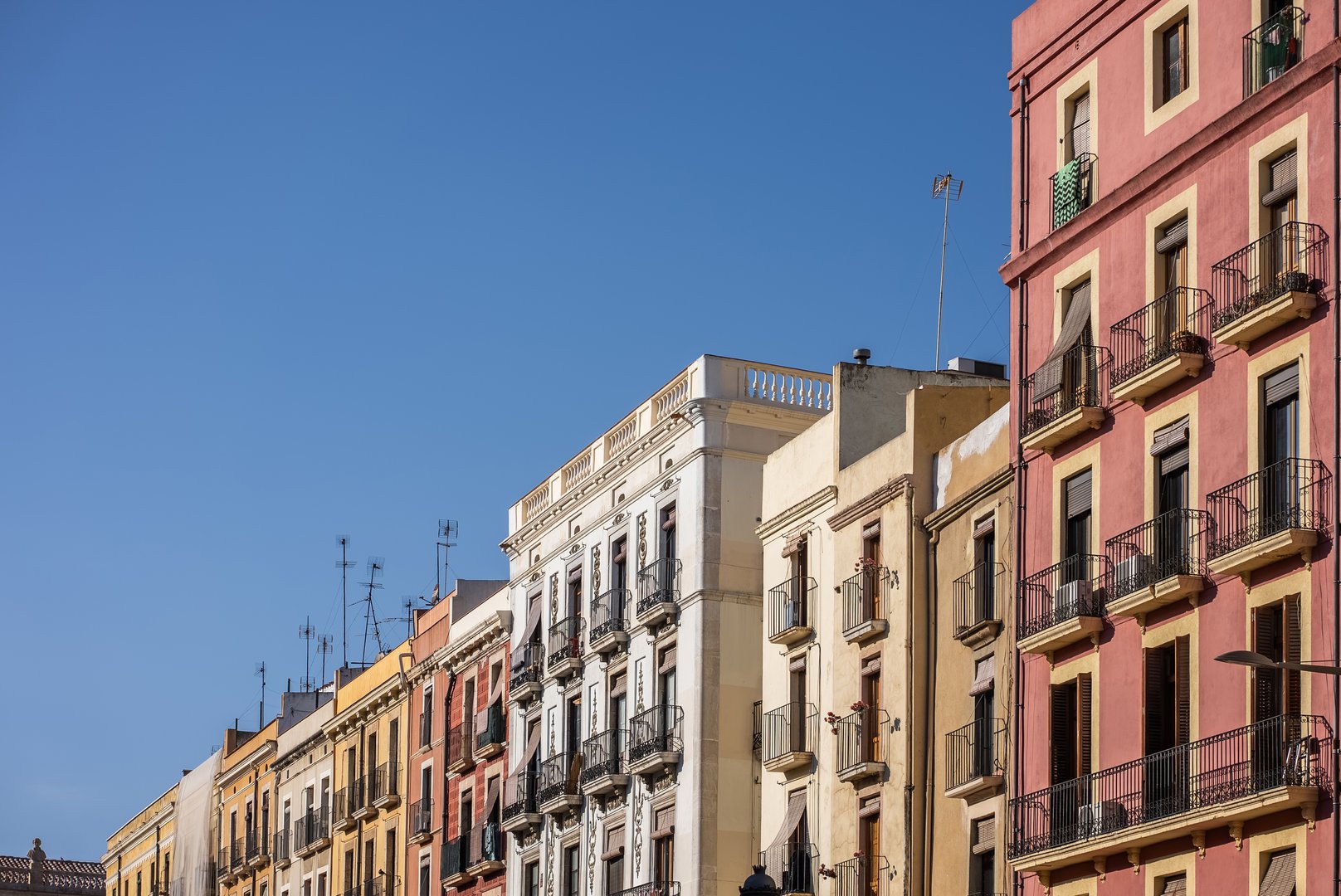 colorful houses exterior of European town Tarragona, cozy colourful Spanish buildings and home facades, Catalonia. High quality photo