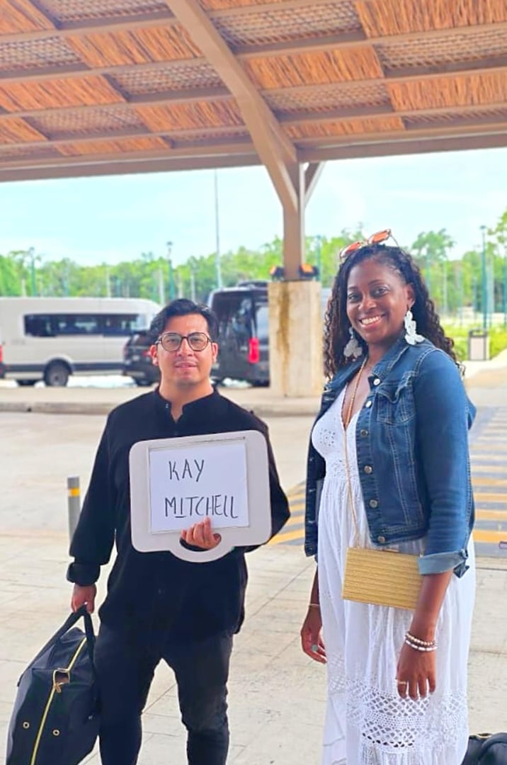 Meet and greet Tulum Airport - Professional customer service representative welcoming tourists at Tulum International Airport for private transportation