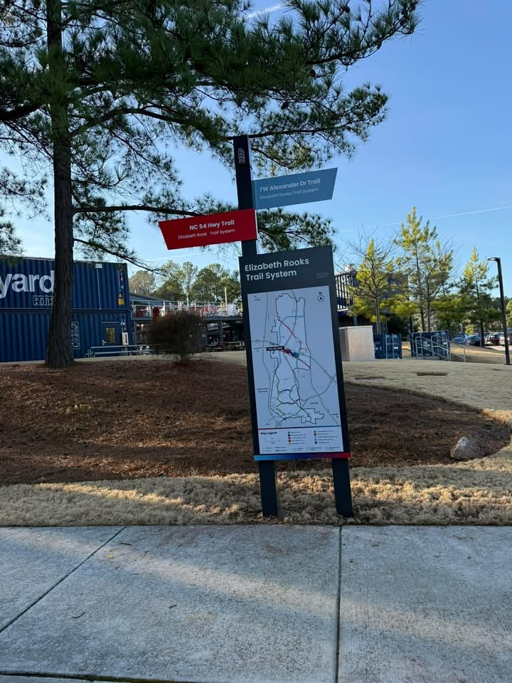 Worker Installing Winter Sales Signage - Paris