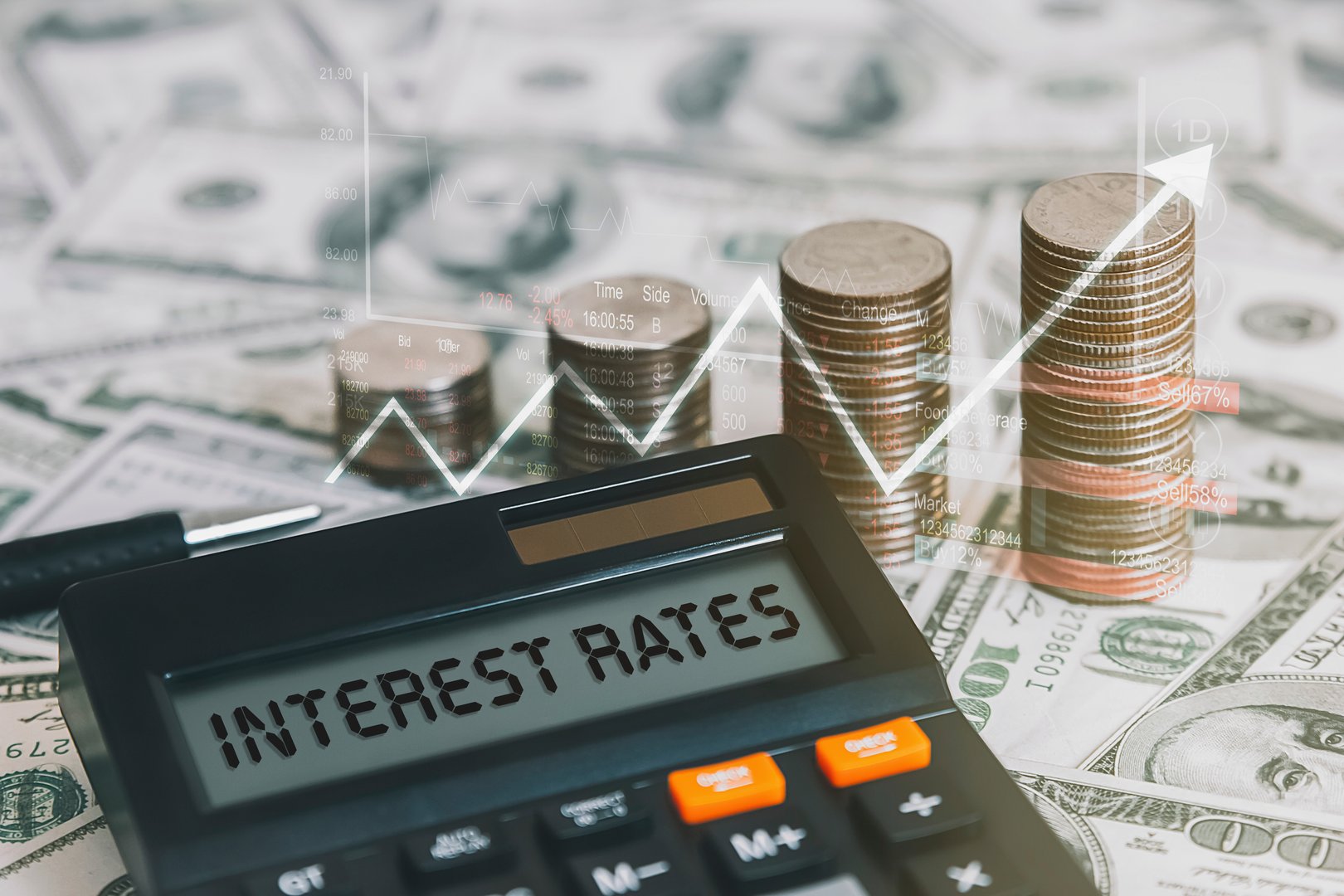 The word interest rate is on a calculator with a coin, a graph, and an arrow pointing up.  Concepts of raising interest rates, economic conditions, inflation, etc.