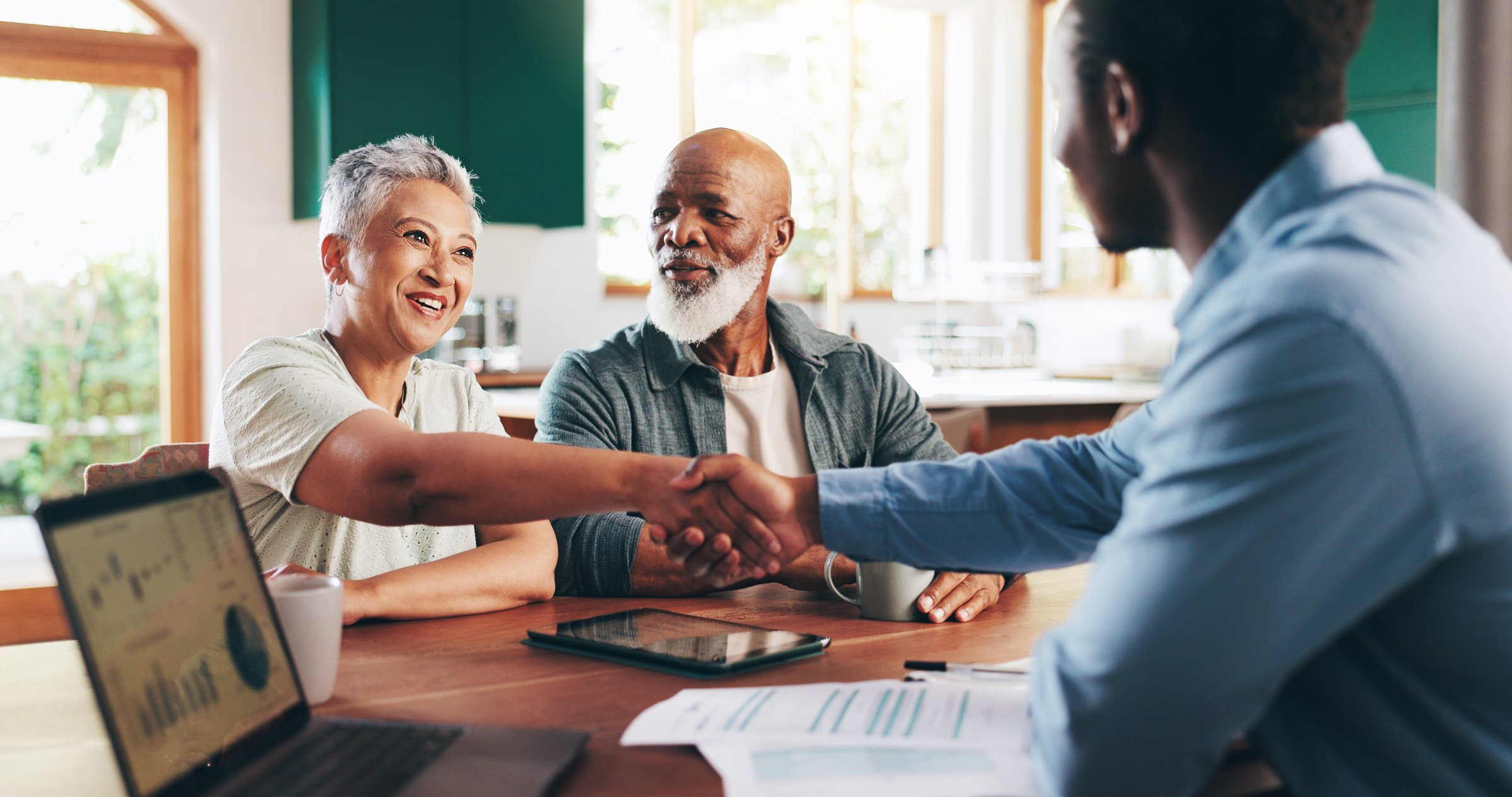 Handshake, thank you and old couple with financial advisor for retirement fund, fraud protection and pension planning. Documents, greeting and shaking hands with people at home for account manager