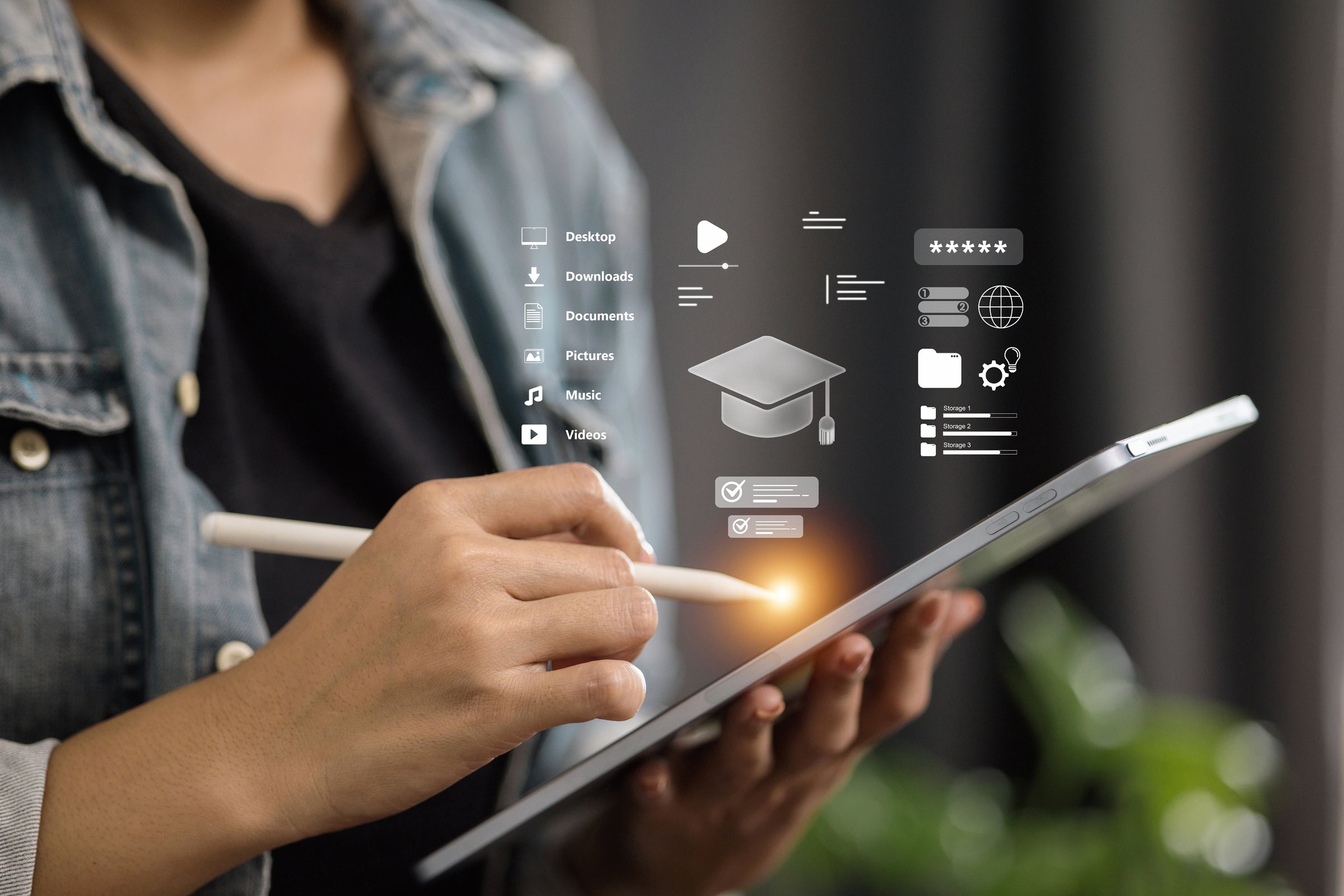 Hand using tablet with digital graduation cap and folder icons, representing education management, e-learning, and digital organization.