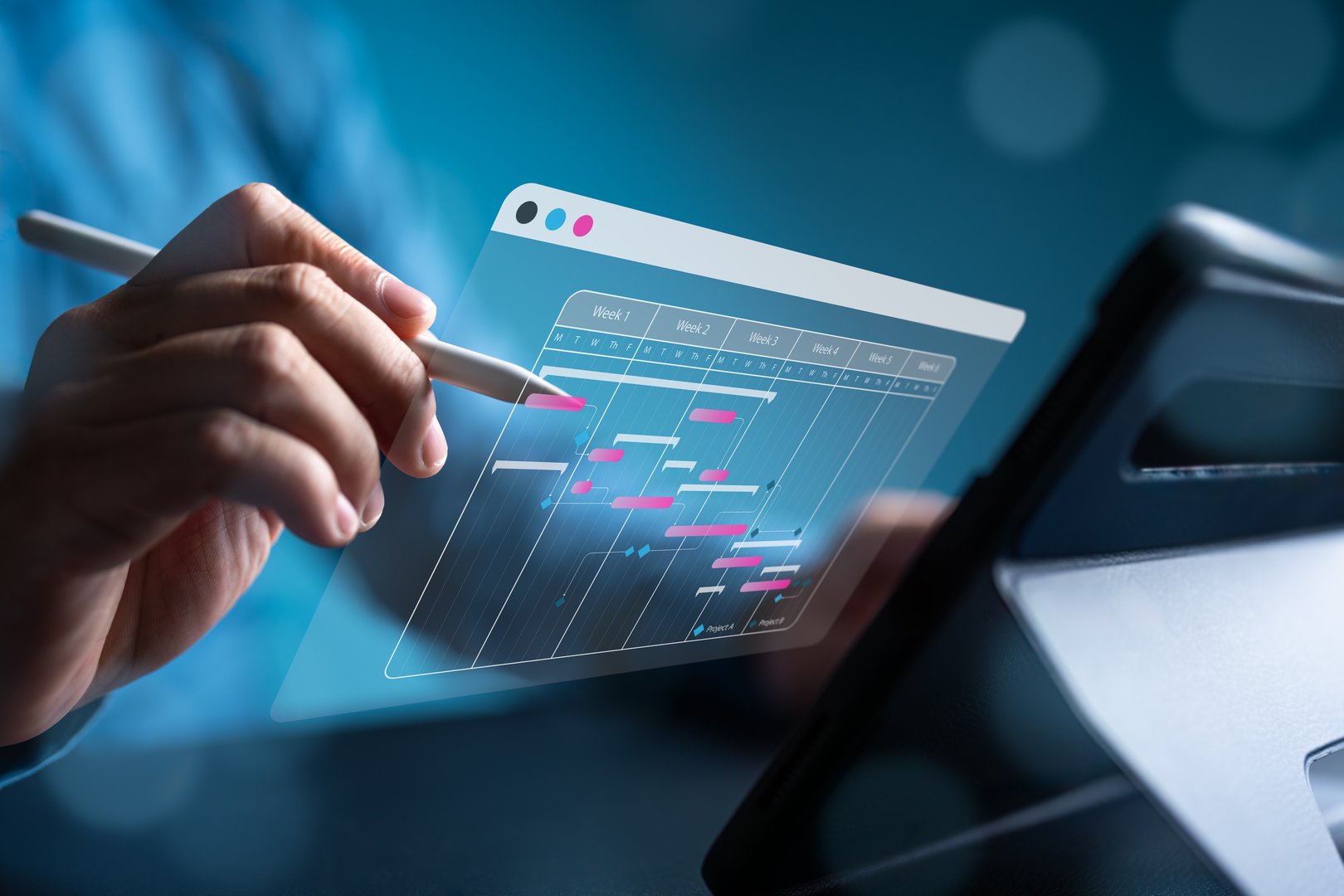 Project engineer or site manager uses laptop to manage construction or operation plans with Gantt chart schedules. Update or track engineering progress. Make scheduling, or proceeding task reports.
