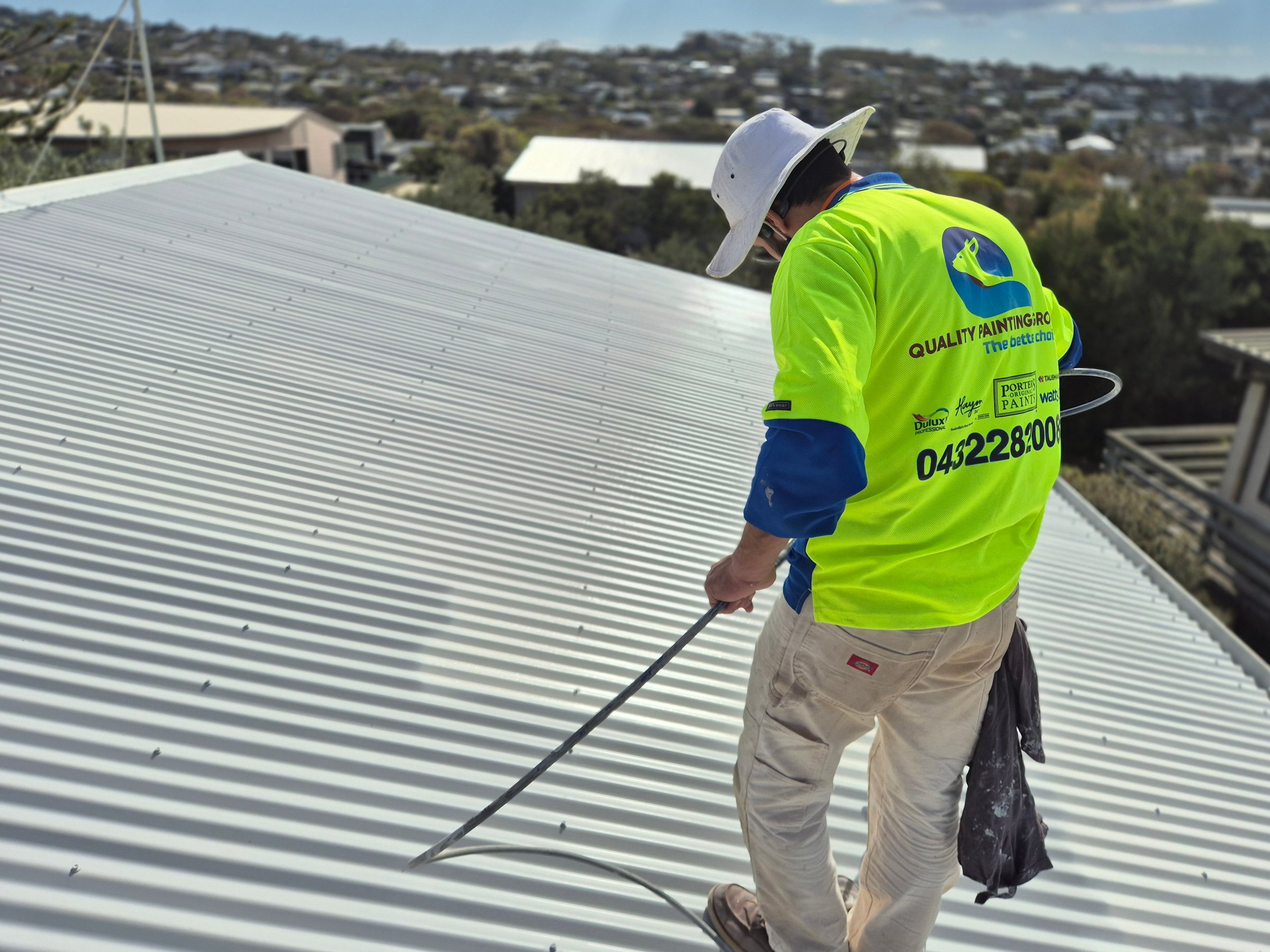 Professional roof painting and coating work by Quality Painting Group