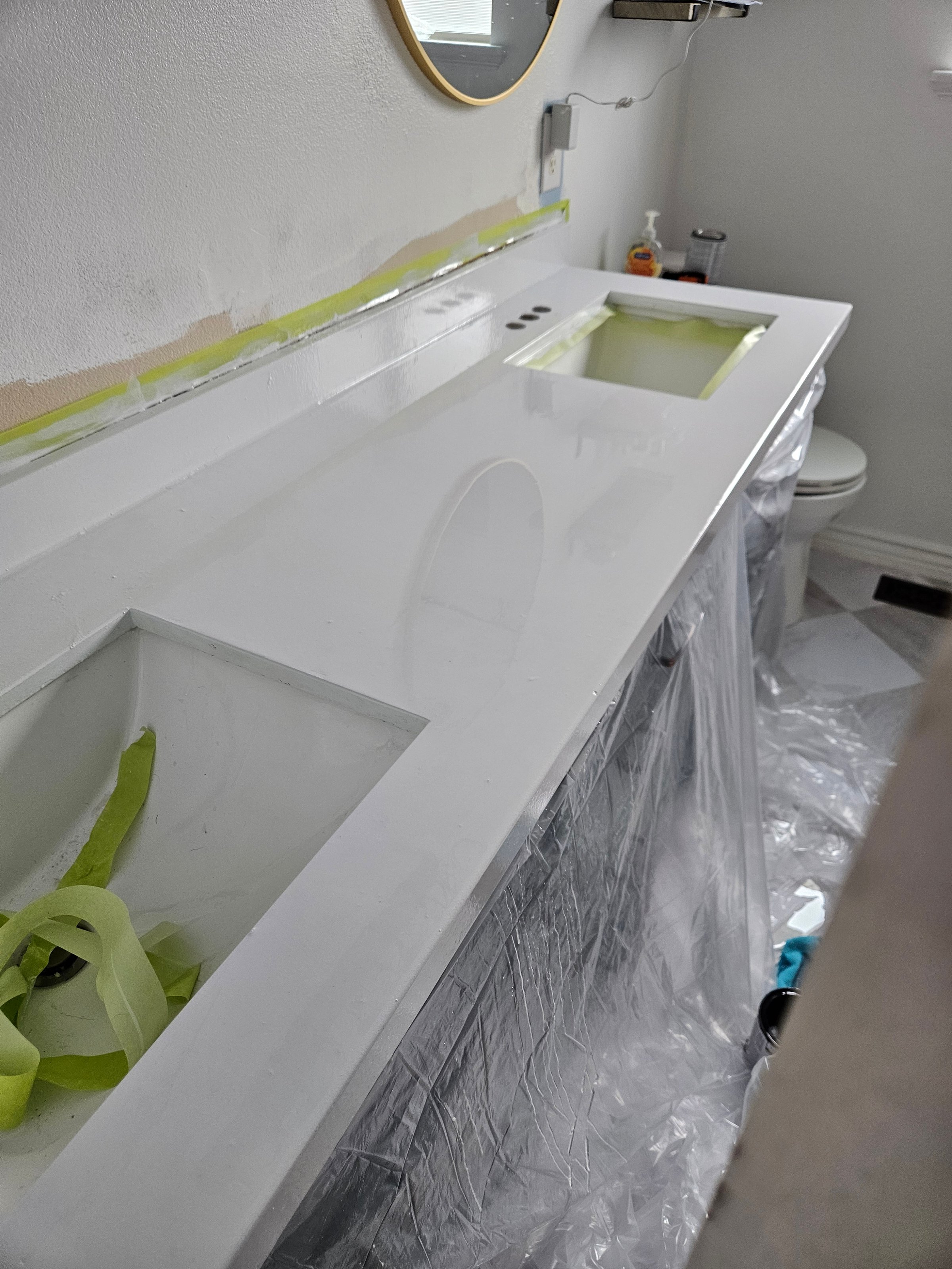 Gianni White Glass epoxy being applied to bathroom countertop