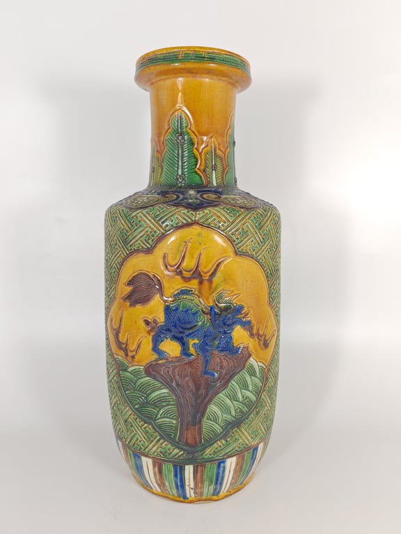Qing Dynasty Plain Three-Color Glazed Vase with Qilin and Banana Leaf Pattern on a Cotton-like Carved Surface  清代 素三彩麒麟蕉叶绵地纹棒槌瓶, Qty - 1